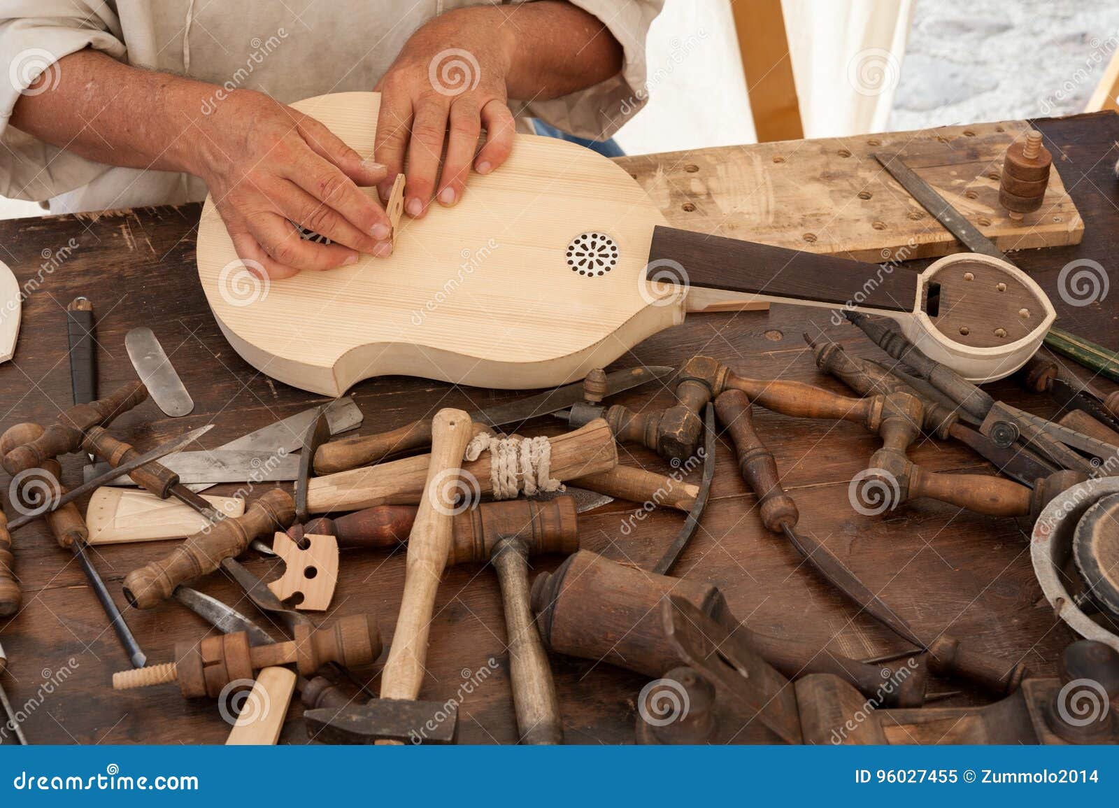 the luthier builds a medieval stringed instrument