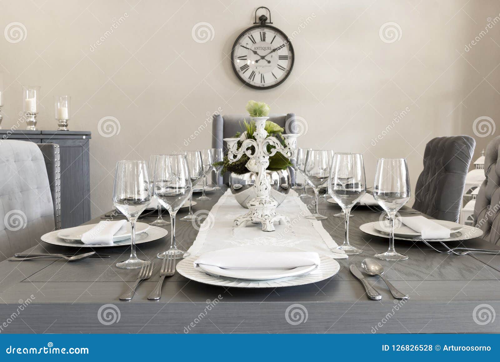 a luxurious dining room of a house with glasses and plates