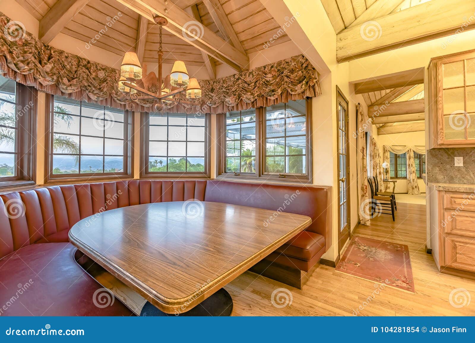 Luxurious Kitchen Table With Booth Style Seating Area In An Upscale Cottage Home Stock Photo Image Of Dine