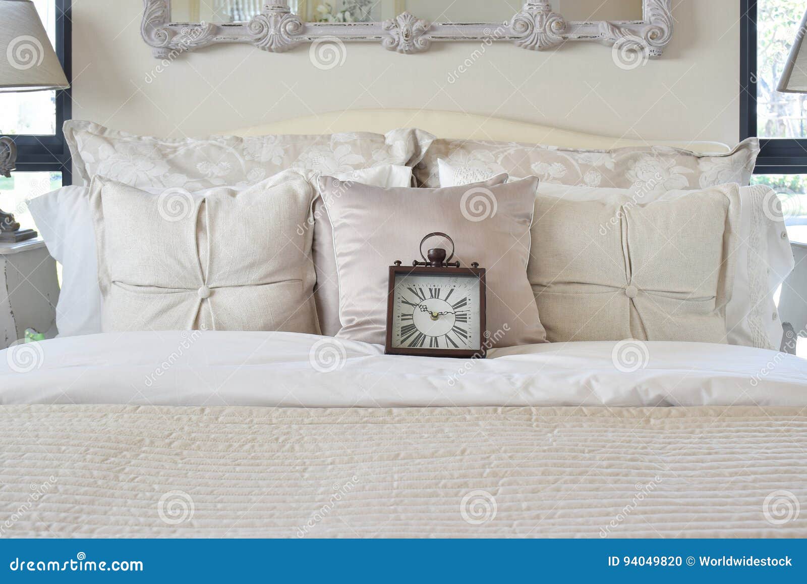 Luxury Bedroom with Classic Style Alarm Clock on Bed Stock Photo