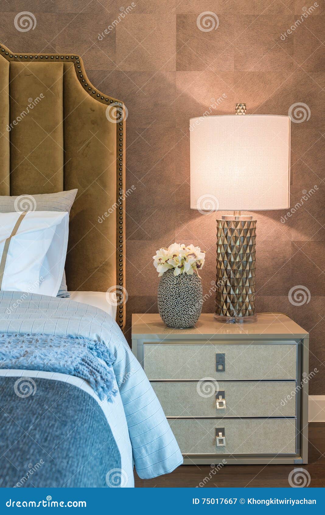Luxury Bedroom with Set of Pillows on Bed and White Lamp Stock Image