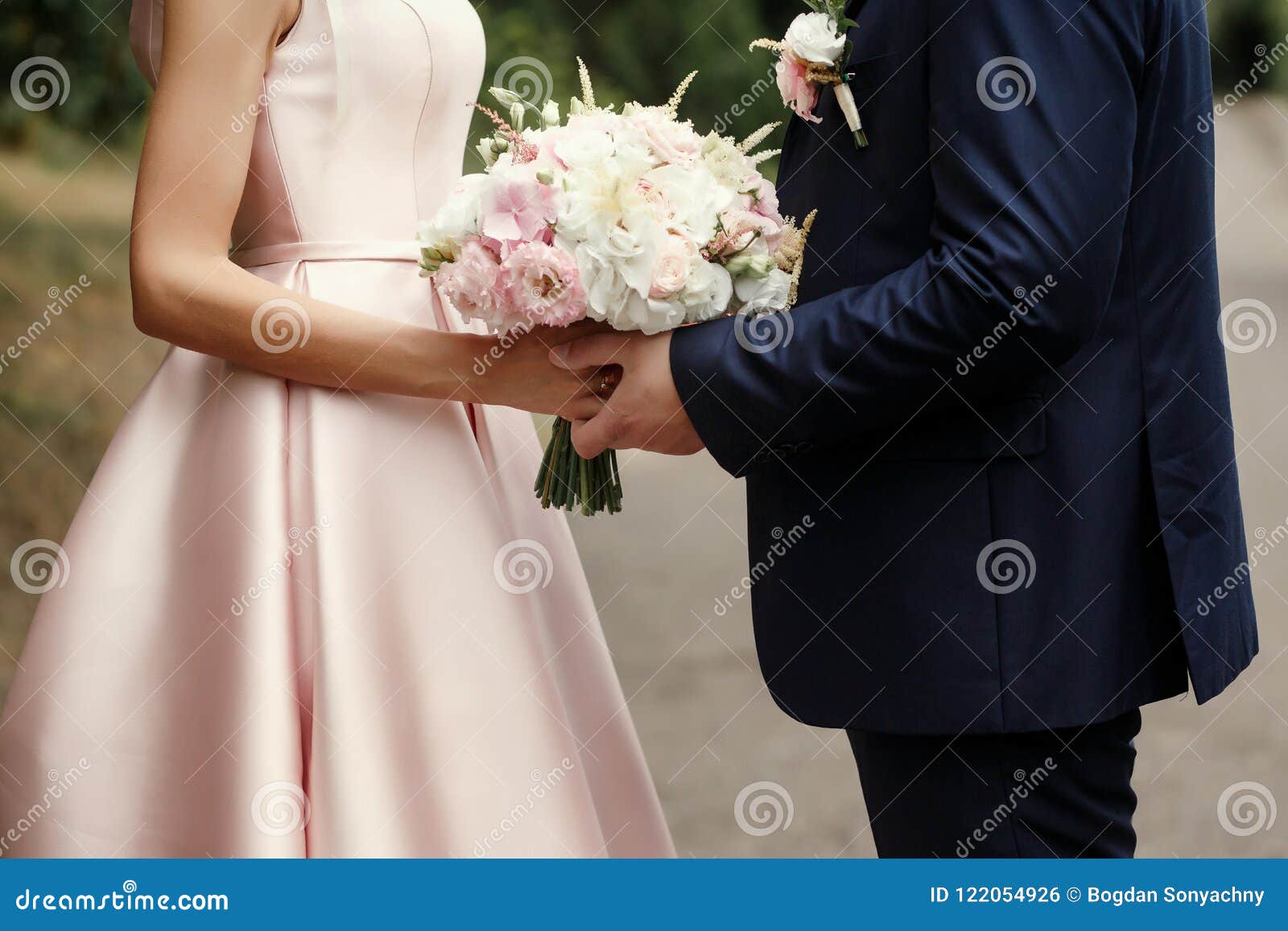 Luxury Bride and Groom Holding Hands and Gorgeous Pink and White Stock ...