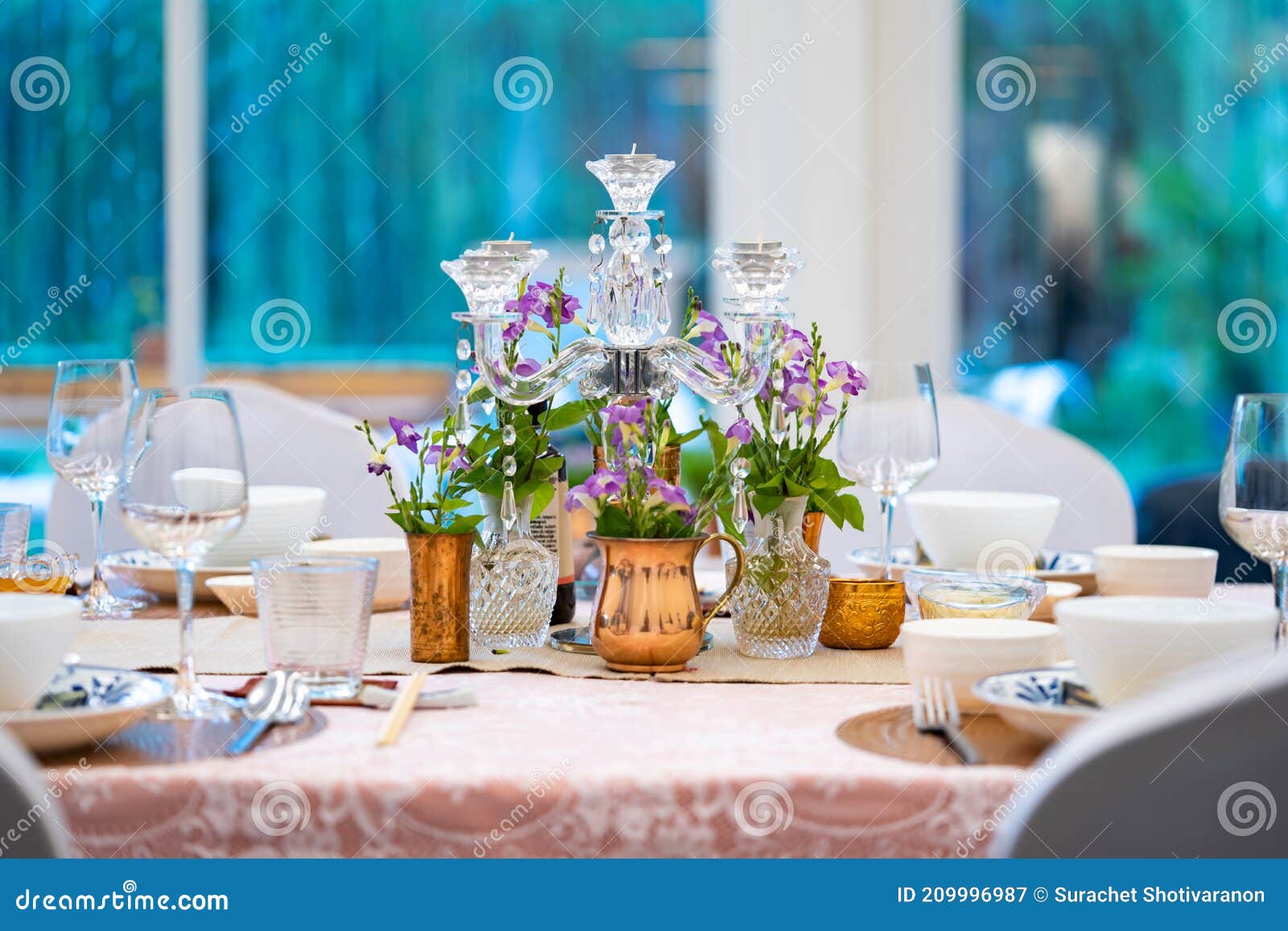 The Luxury Dinner Set on the Table with Green and Pink Theme Stock