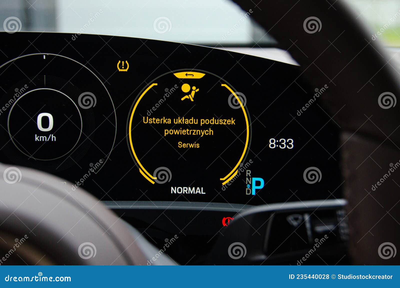 luxury elektric car dashboard with airbag warning light. car in car repair shop on computer diagnostic