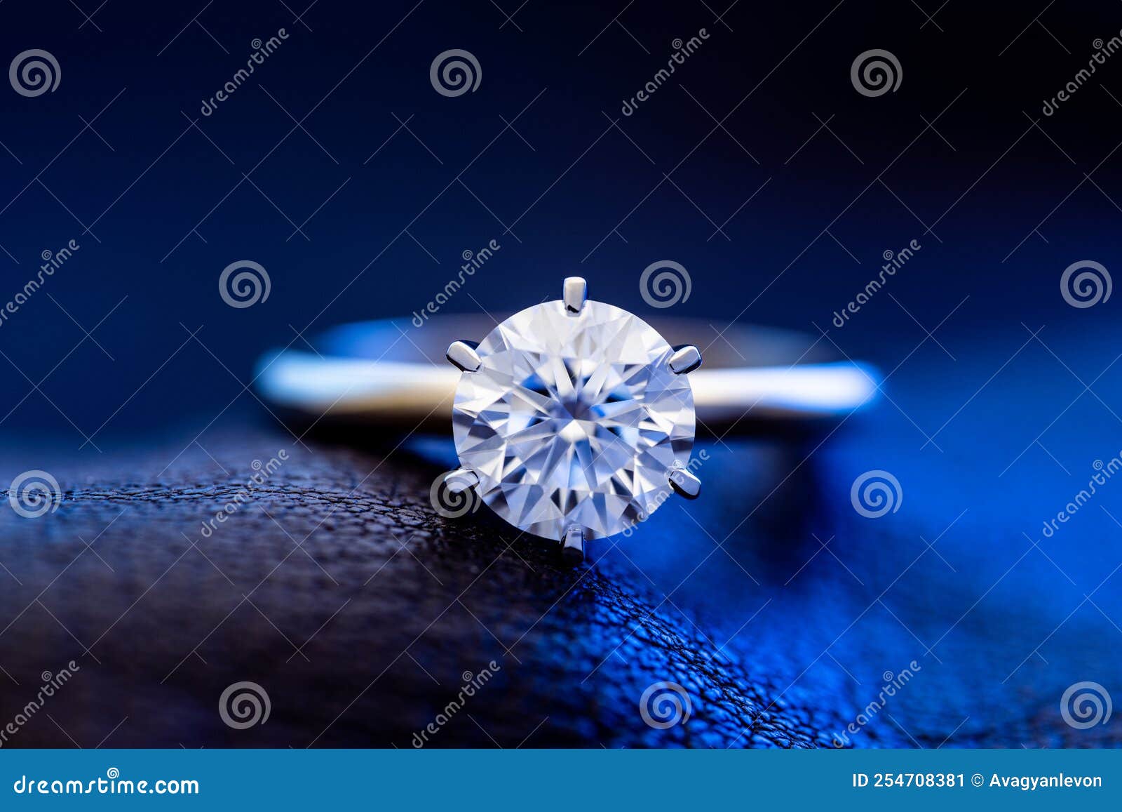 Luxury Engagement Diamond Ring on Blue Light Background Stock Image