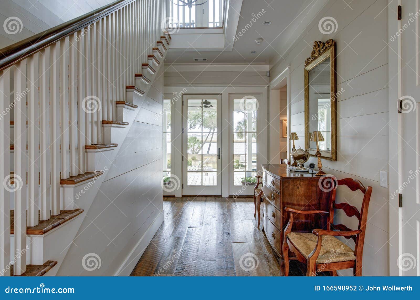 luxury home entry foyer with view out onto waterfront property