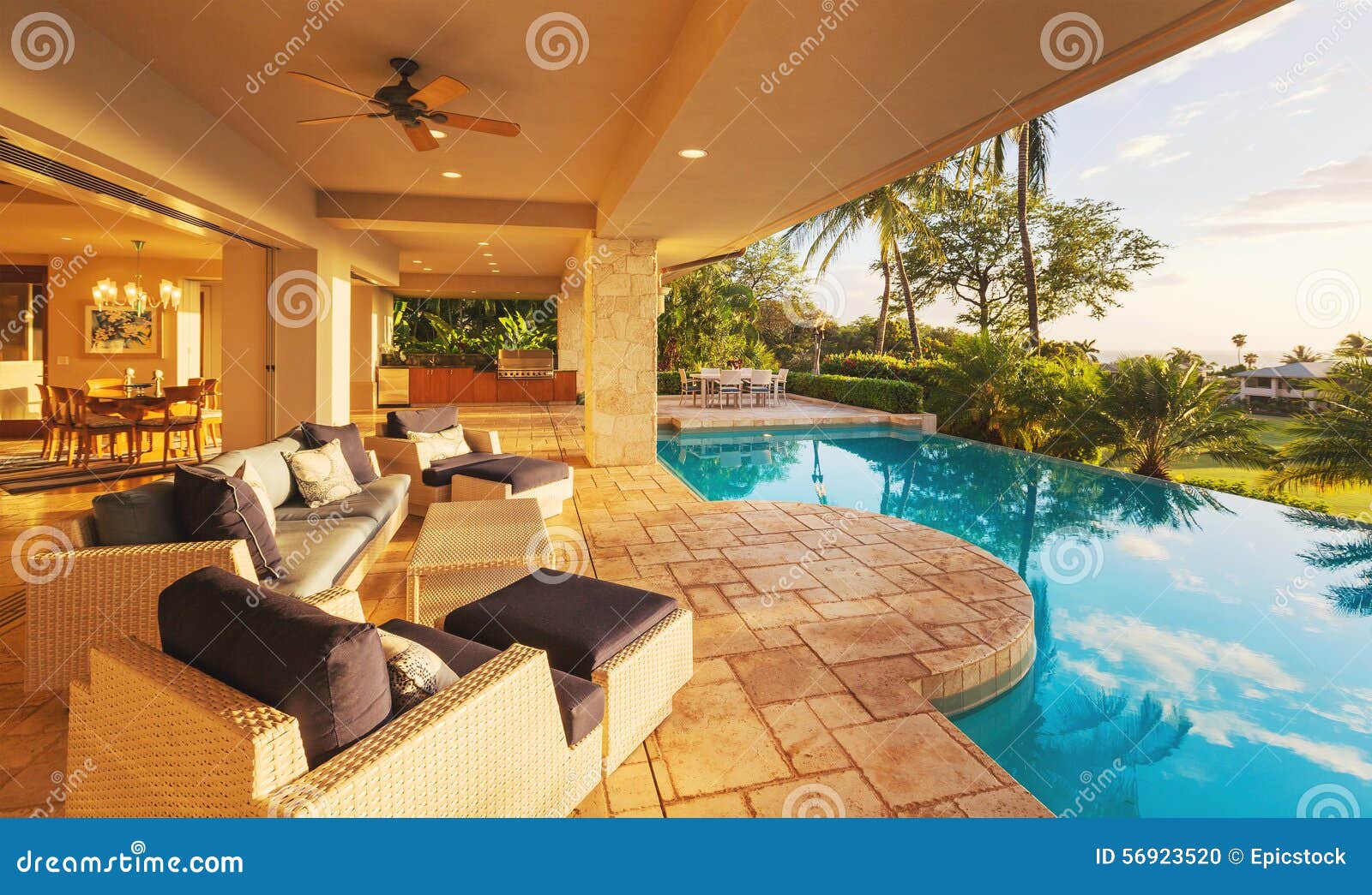 luxury home with pool at sunset