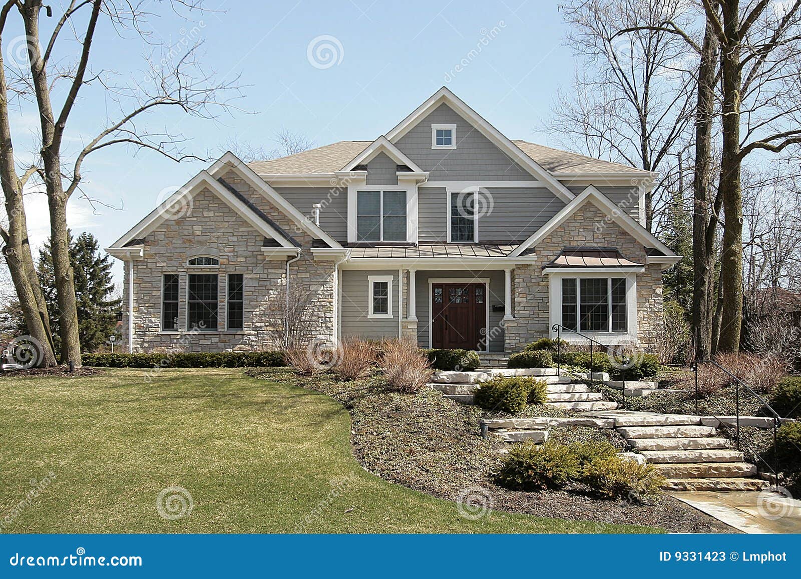 luxury home with stone facade