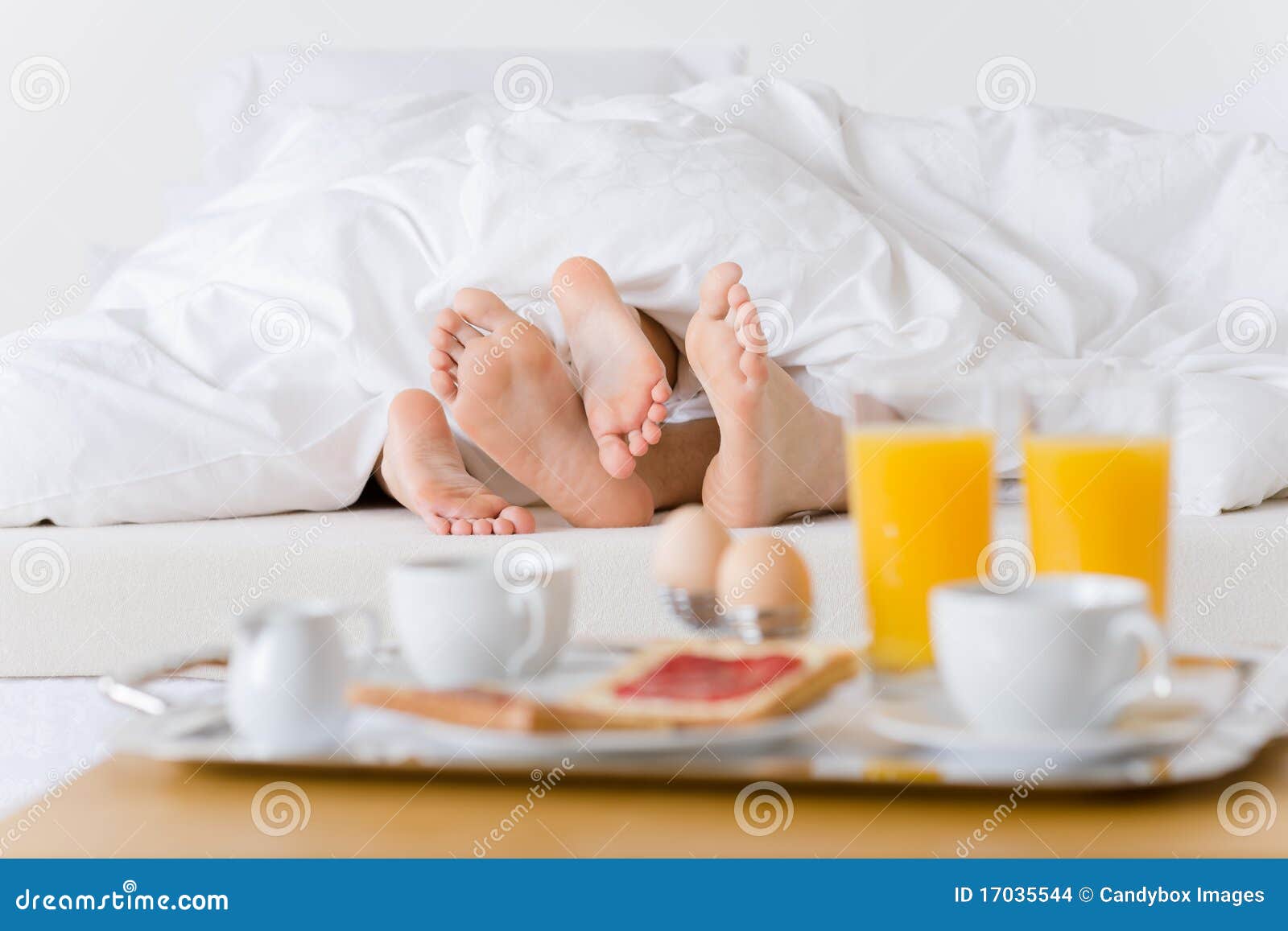 luxury hotel honeymoon breakfast - couple in bed