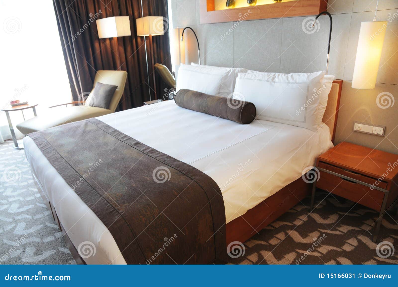 luxury hotel room with king size bed