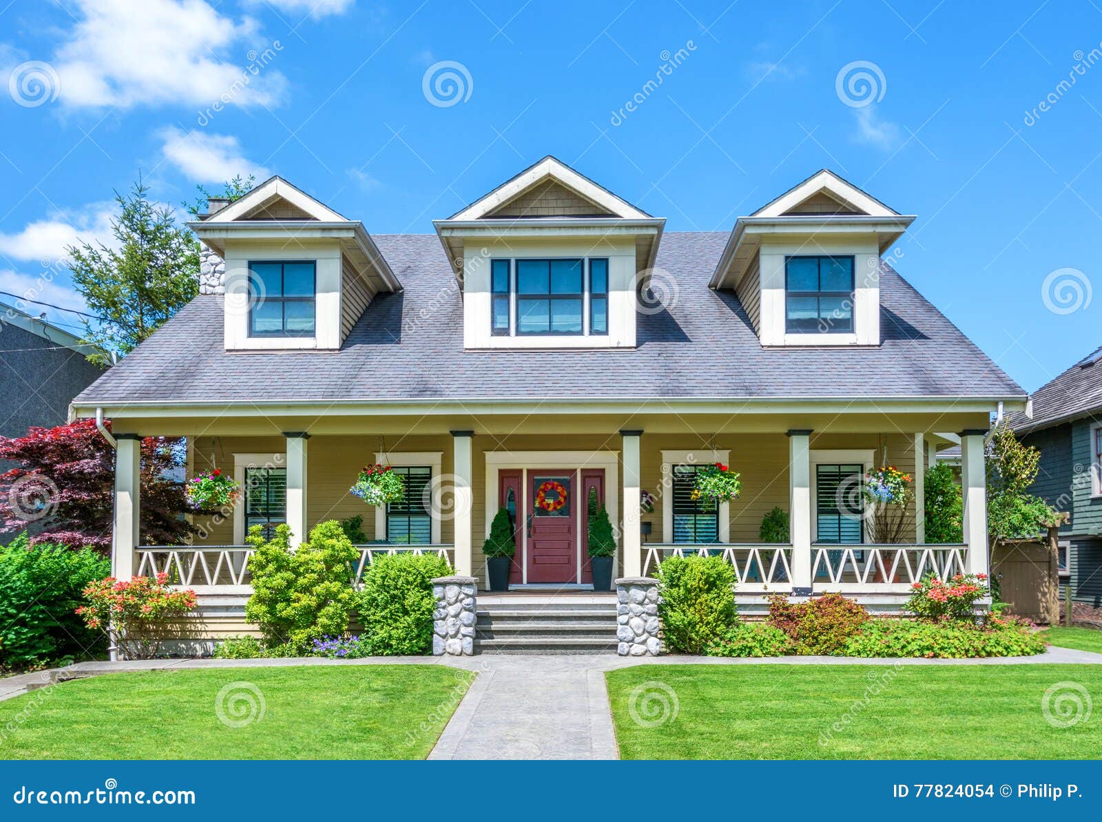 Luxury House with Beautiful Landscaping on a Sunny Day Stock Photo