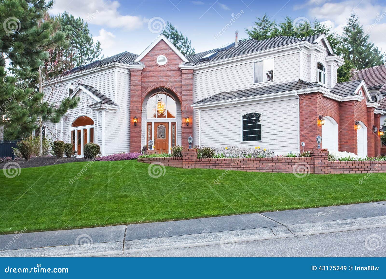 Red brick house with circular driveway and three car garage at twilight  Toronto Ontario Canada Stock Photo - Alamy