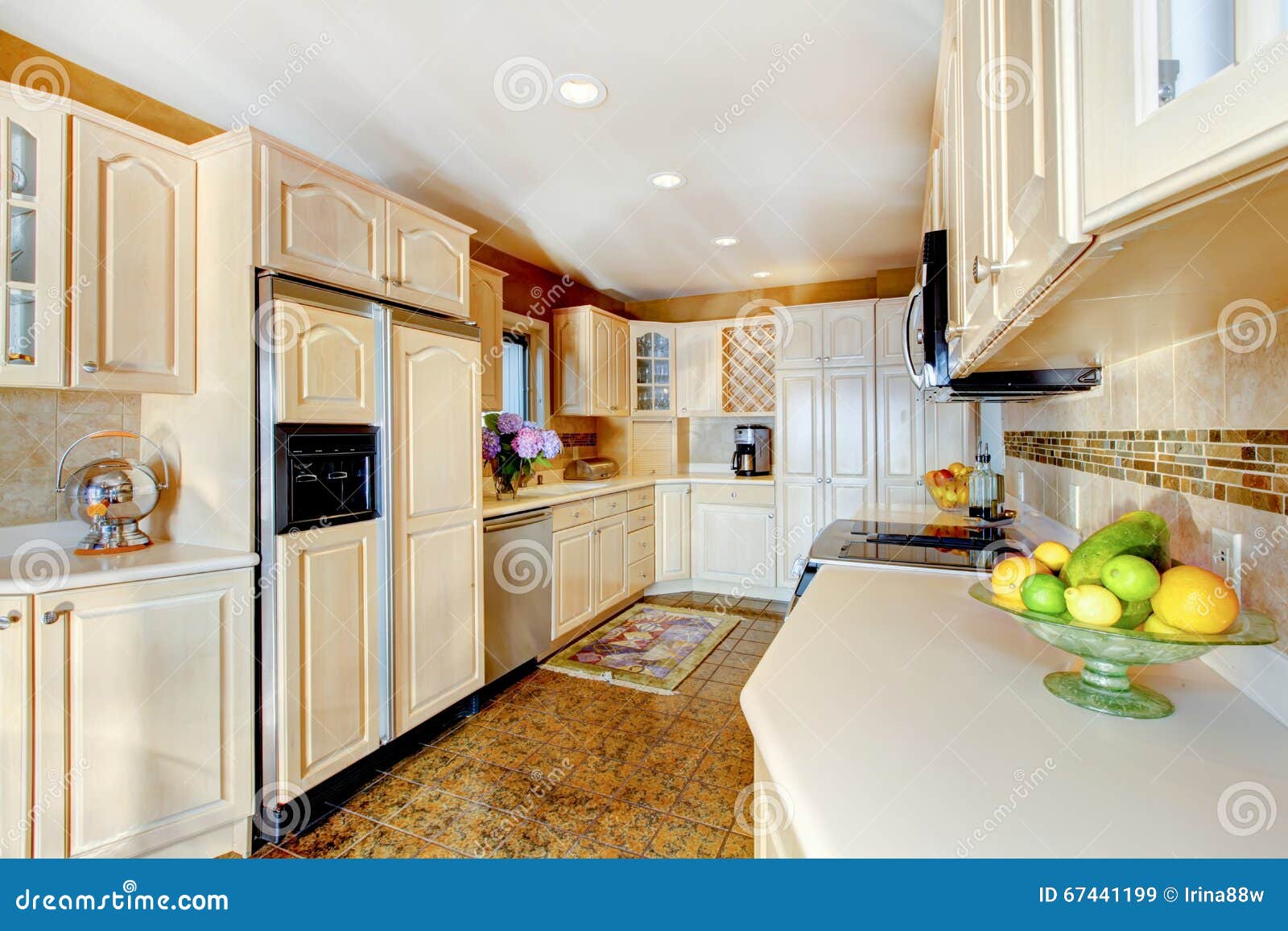 Luxury Kitchen With Cream Cabinets And White Counter Tops Stock