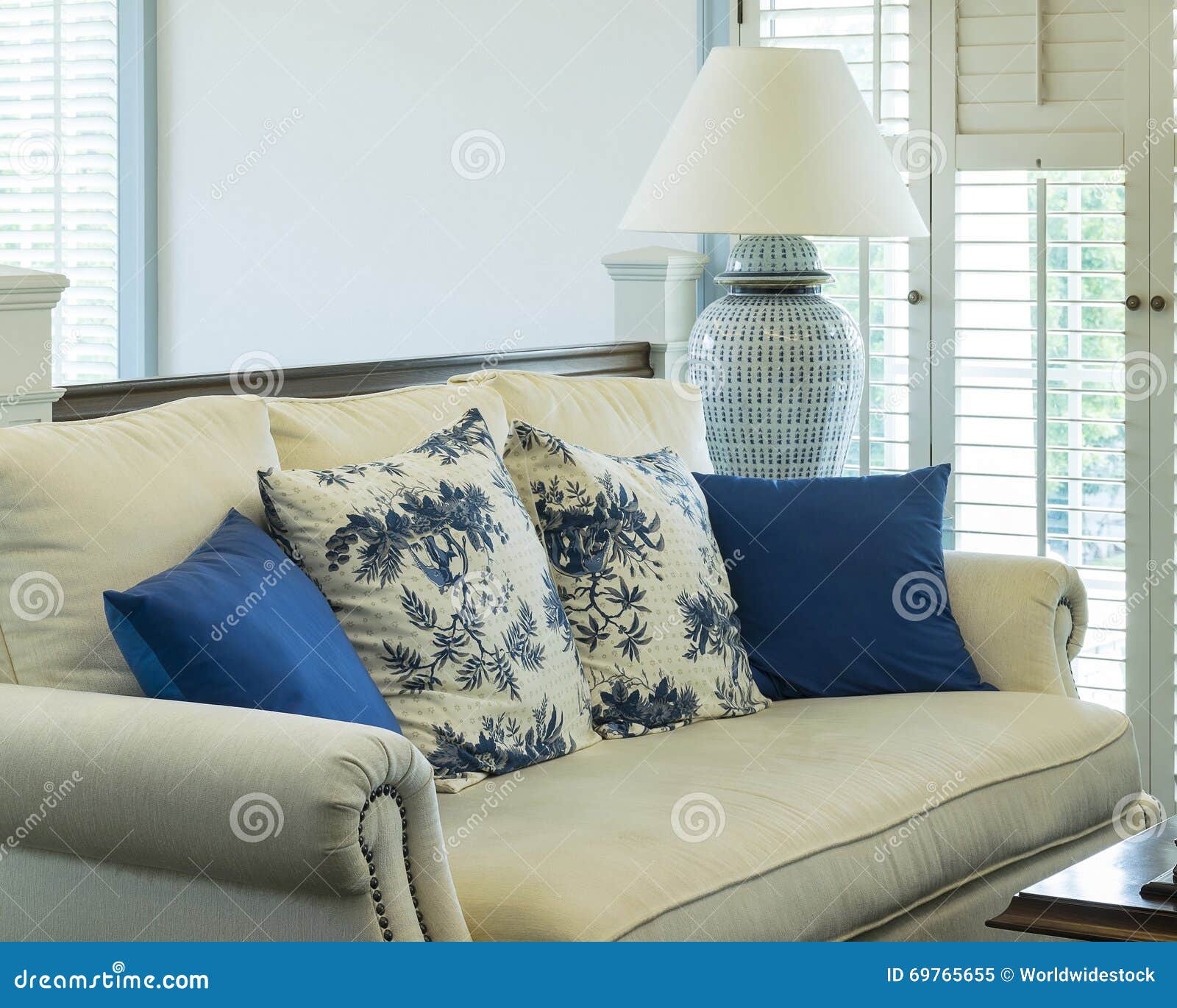 Luxury Living Room with Blue Pattern Pillows on Sofa Stock Image