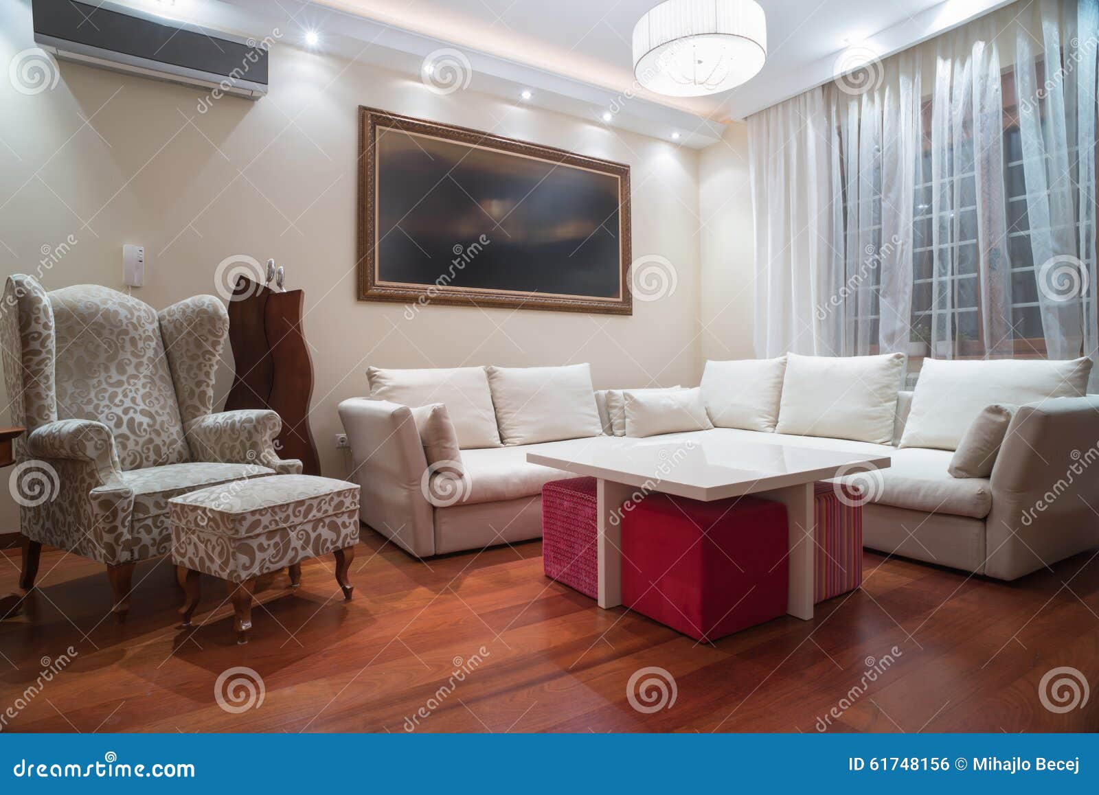 Luxury Living Room with Modern Ceiling Lights Evening Shot Stock