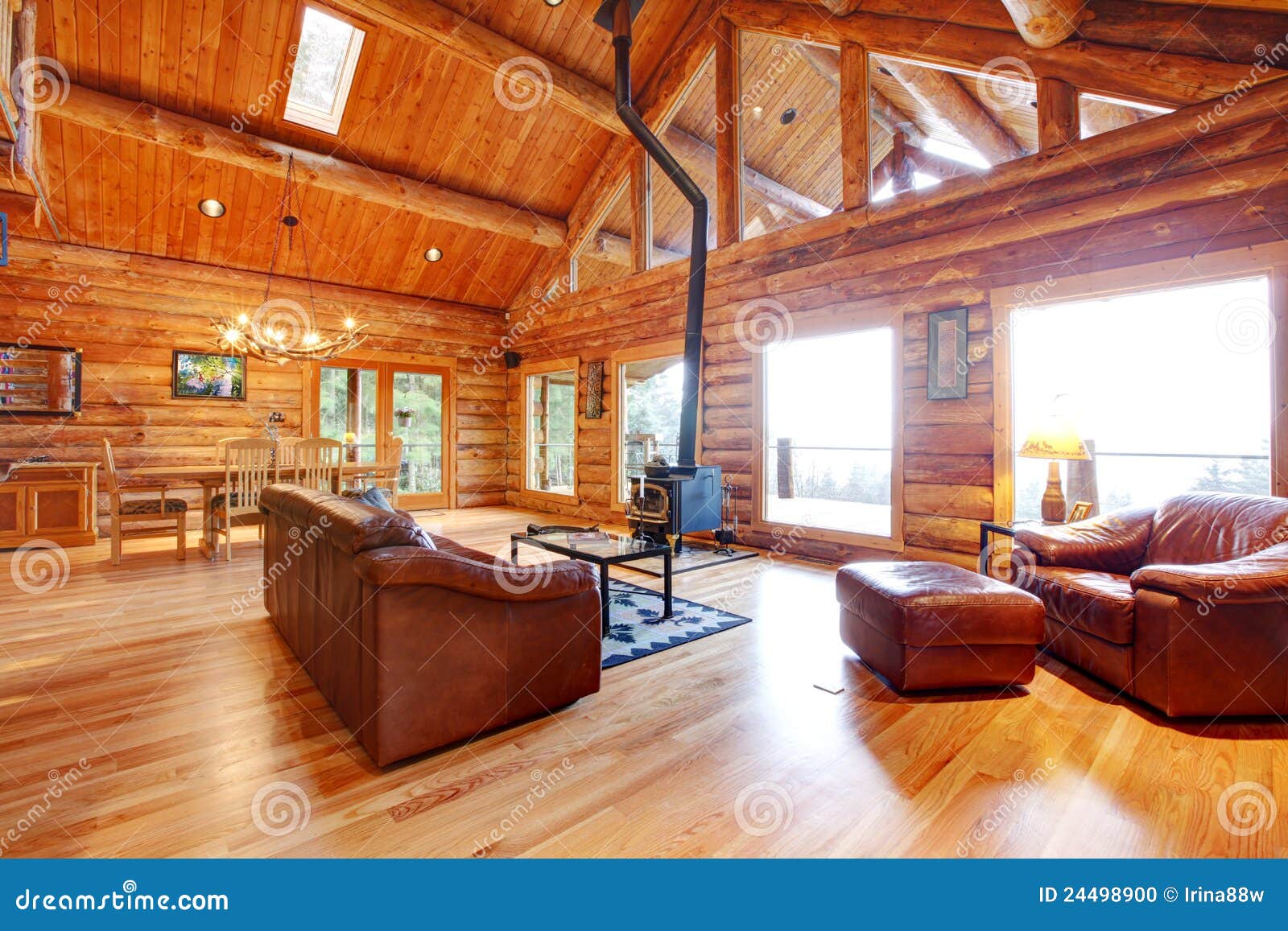 Luxury Log Cabin Living Room With Leather Sofa Stock Photo