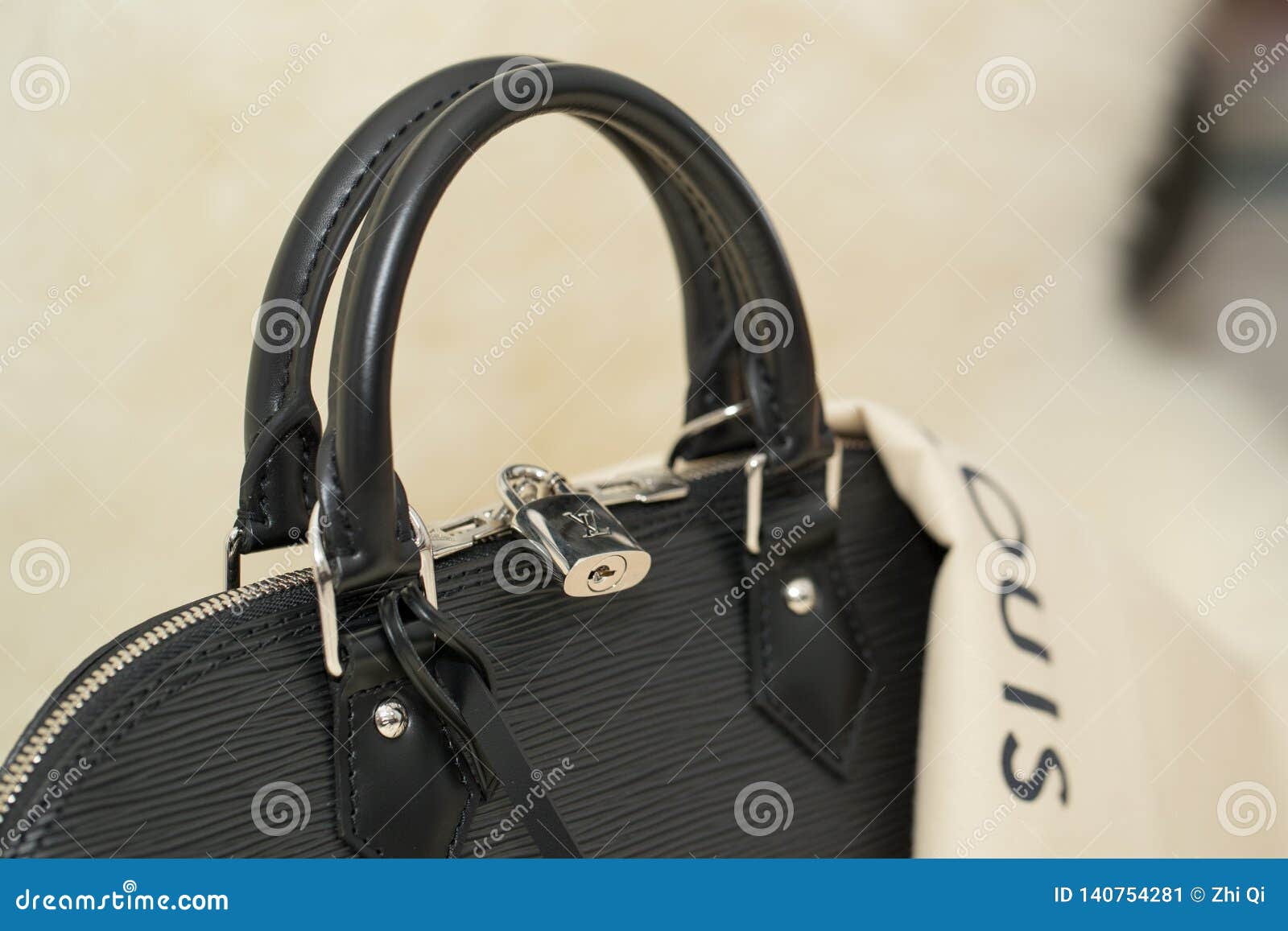 Luxury Louis Vuitton ALMA PM Handbag on the Table Editorial Photo - Image  of display, black: 140754281