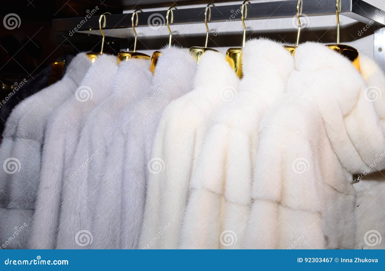 Luxury Mink Coats. White Fur Coats on Showcase of Market. Close Up ...