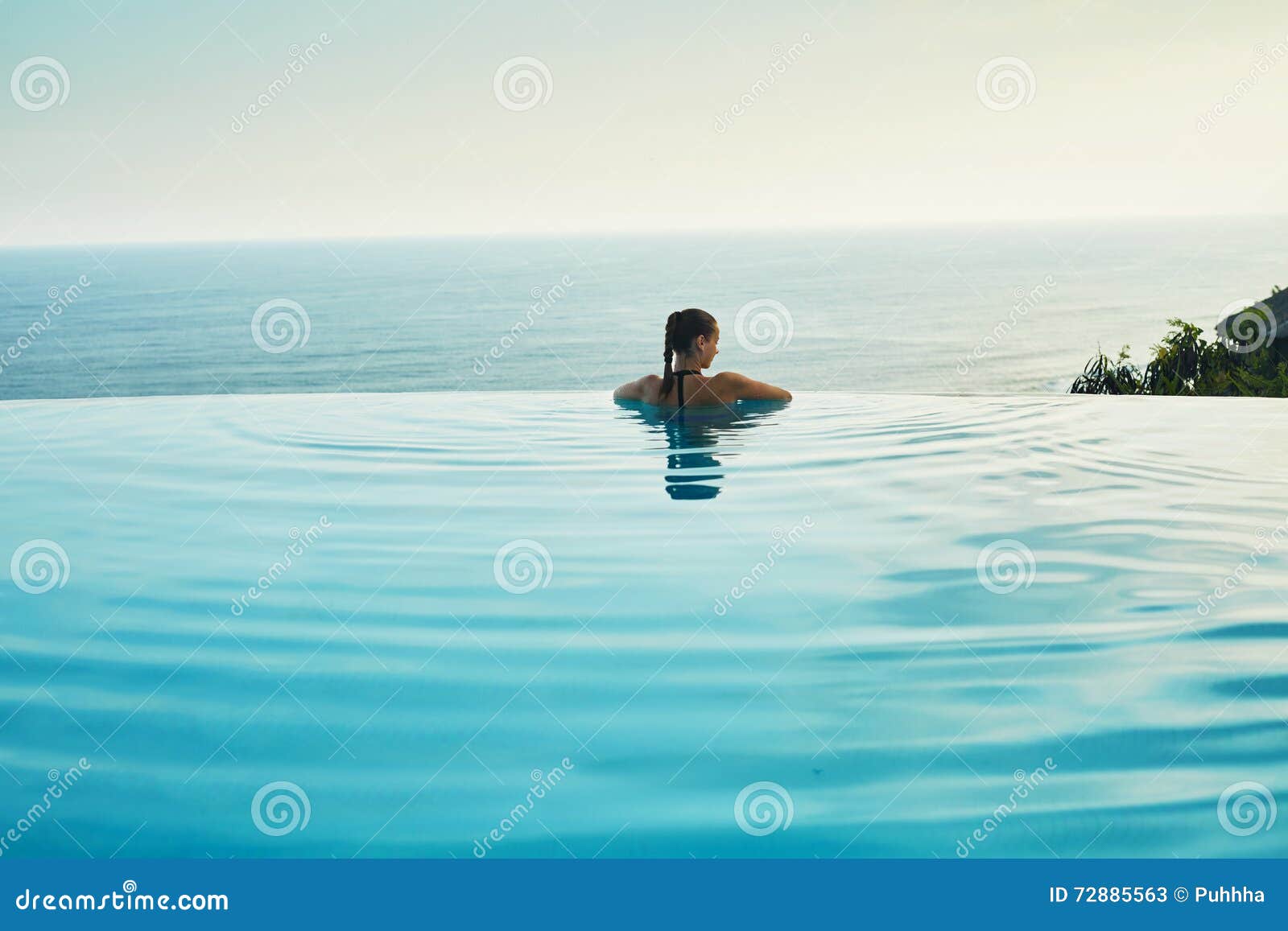 luxury resort. woman relaxing in pool. summer travel vacation