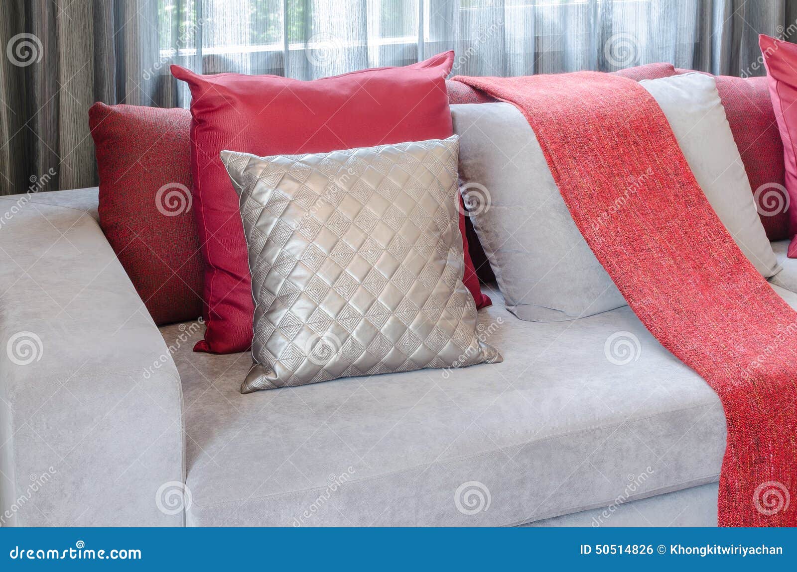Luxury Sofa with Pillows and Red Blanket in Living Room Stock Photo