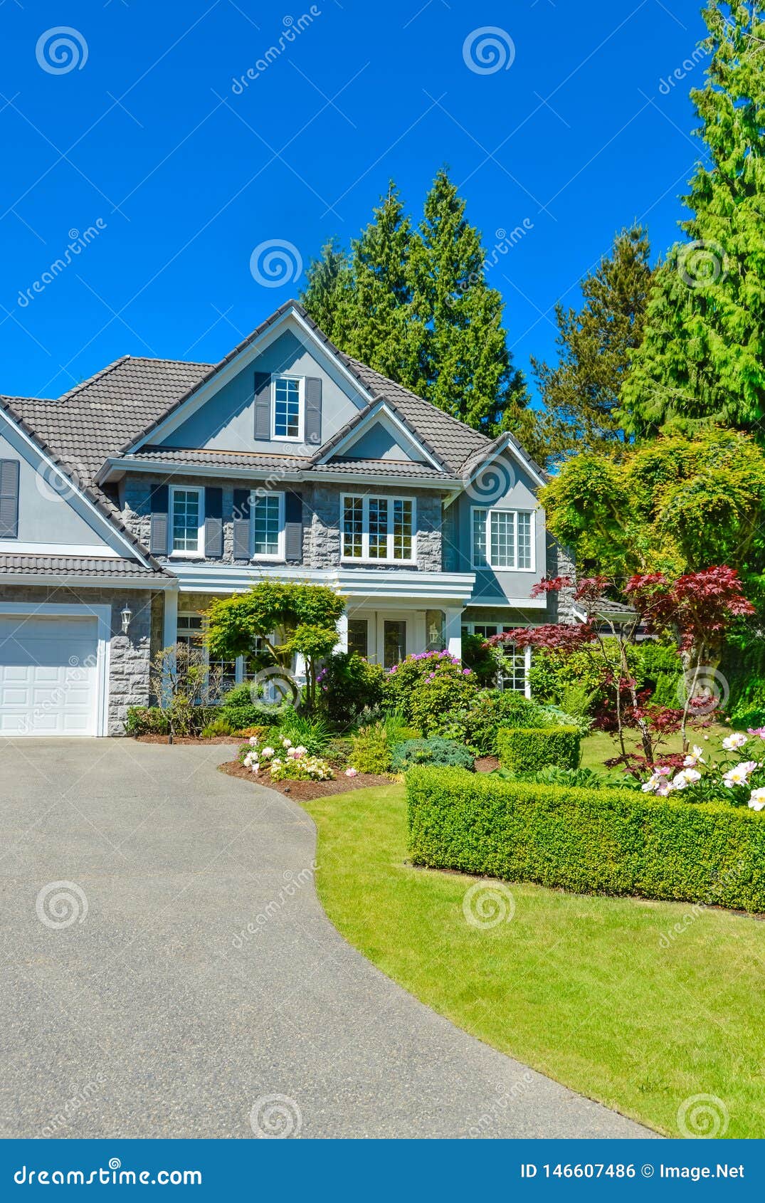 Luxury Suburban House With Double Garage And Car Parked On ...