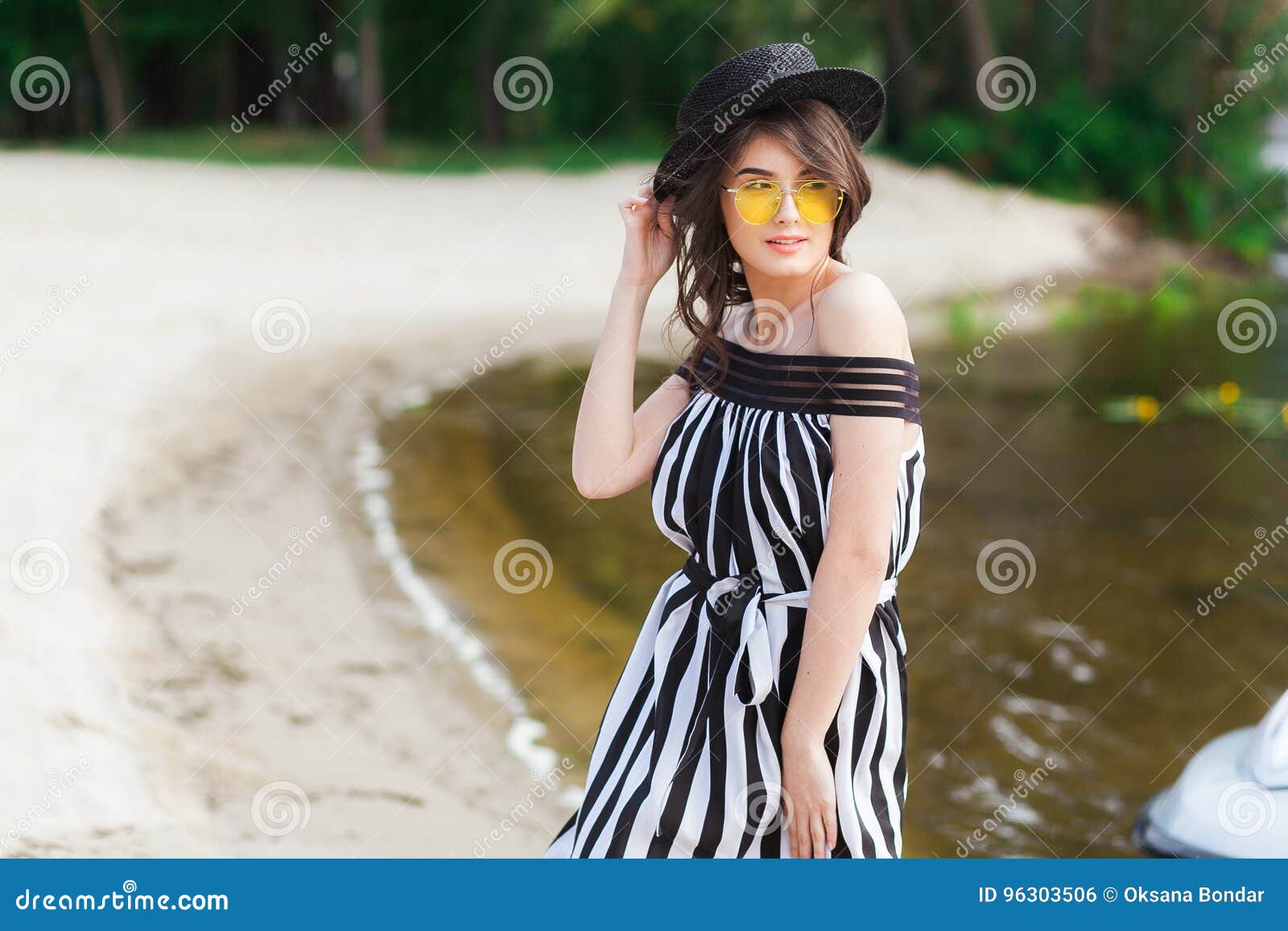 Luxury Travel Woman in Black and White Beachwear Walking Taking a ...