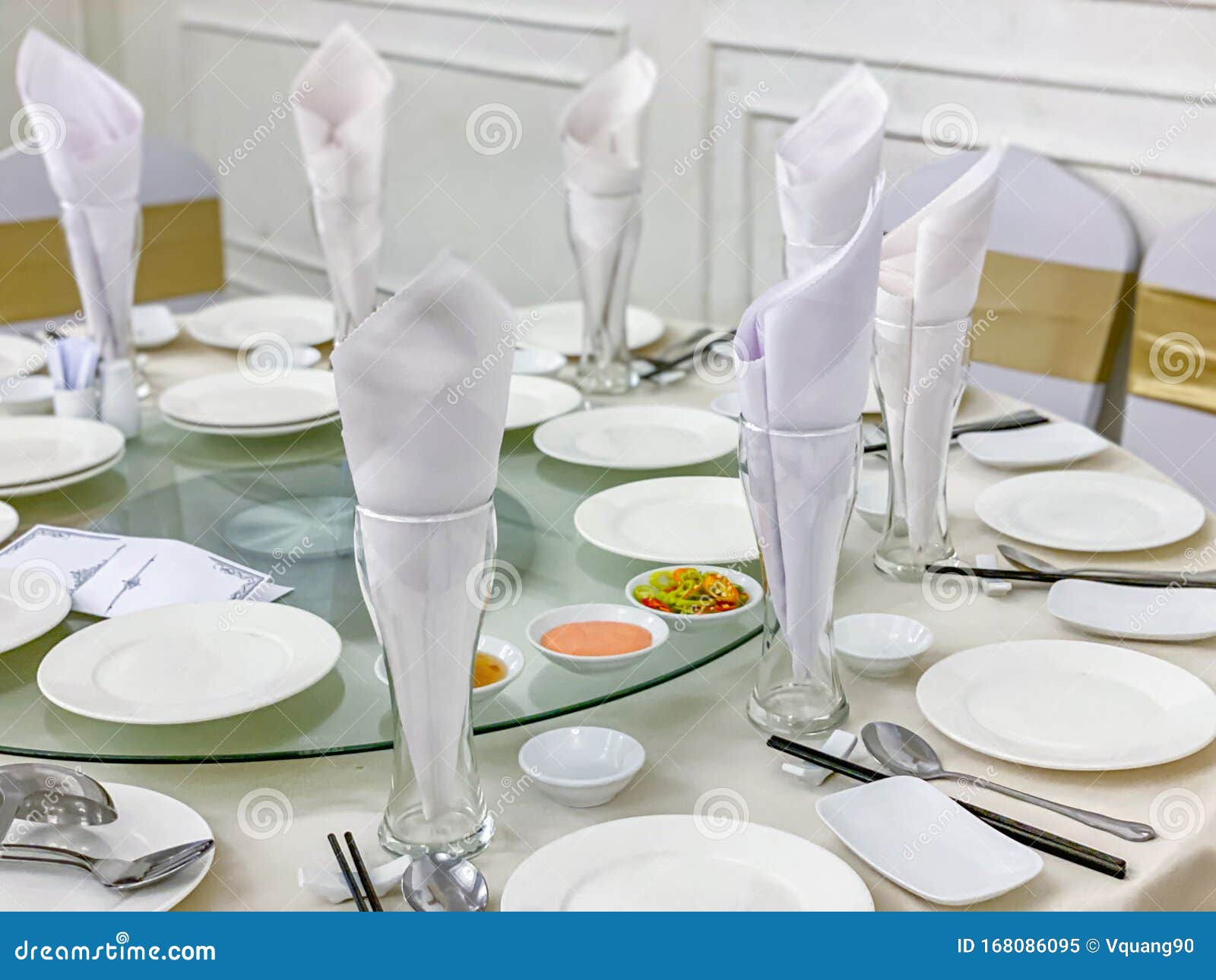 Luxury White Banquet Table Setup with Ceramic Tableware and Glasses
