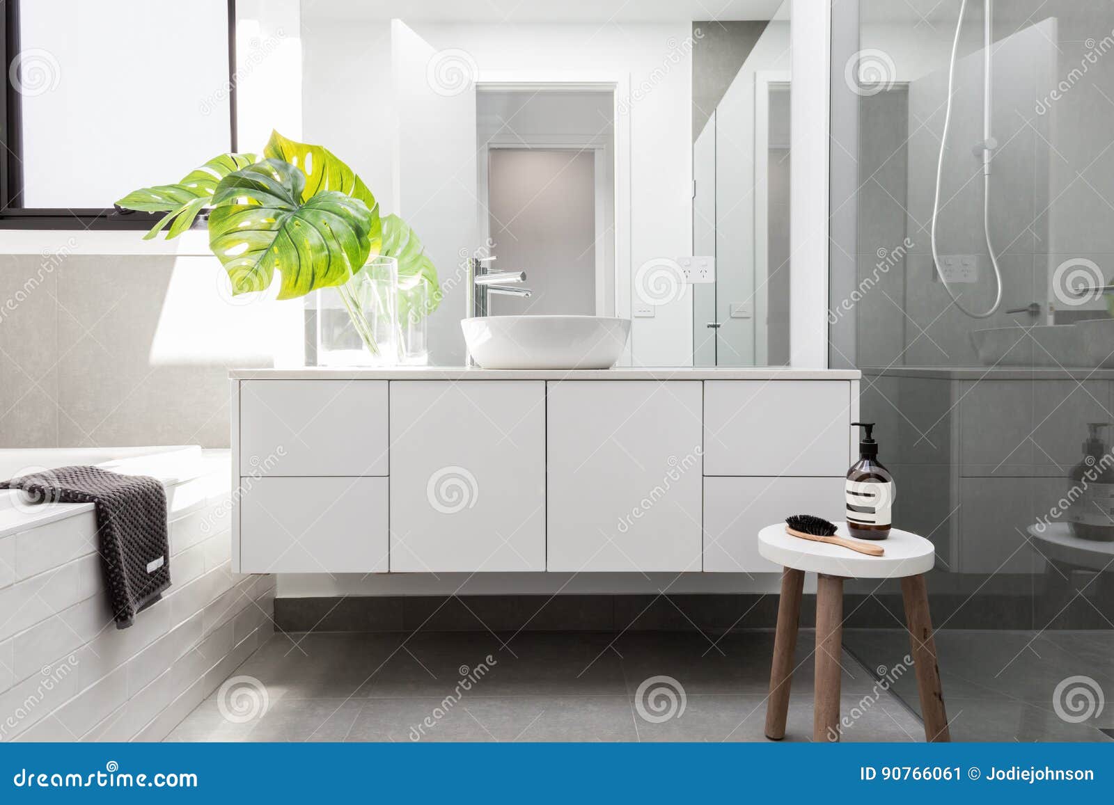 luxury white family bathroom styled with greenery