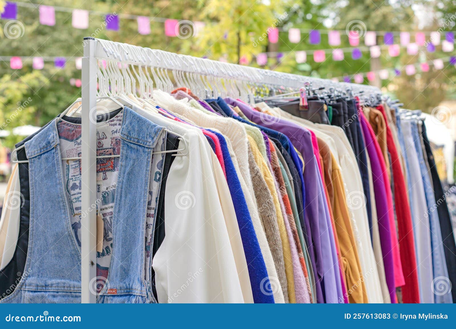 lviv, ukraine - september 29. 2022 : vintage clothes for sale at flea market. clothes on hangers - second hand clothes store