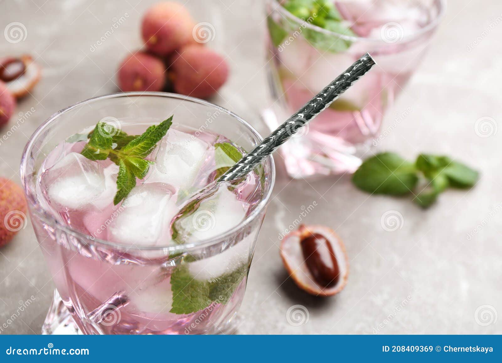 Lychee Cocktail with Mint and Ice on Grey Table, Closeup Stock Image