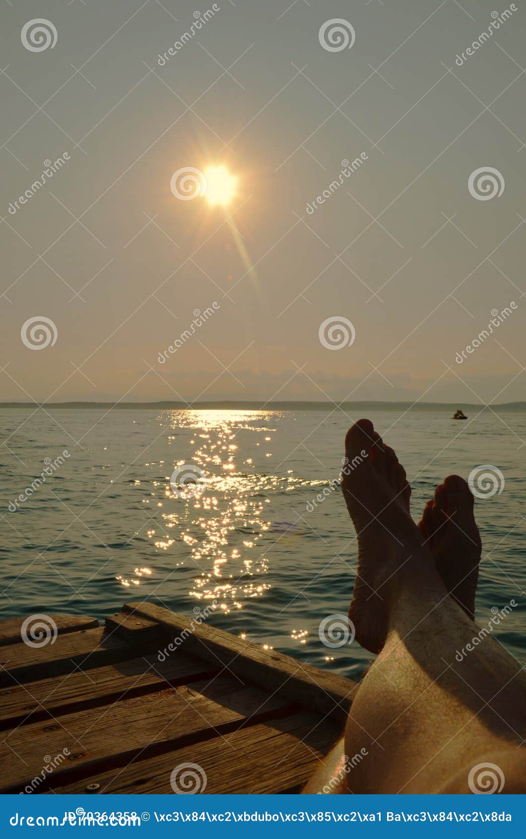 Lying on beach with crossed legs