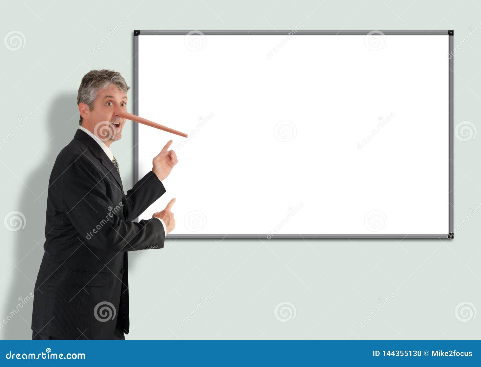 lying dishonest businessman with growing pinocchio nose pointing to blank white board