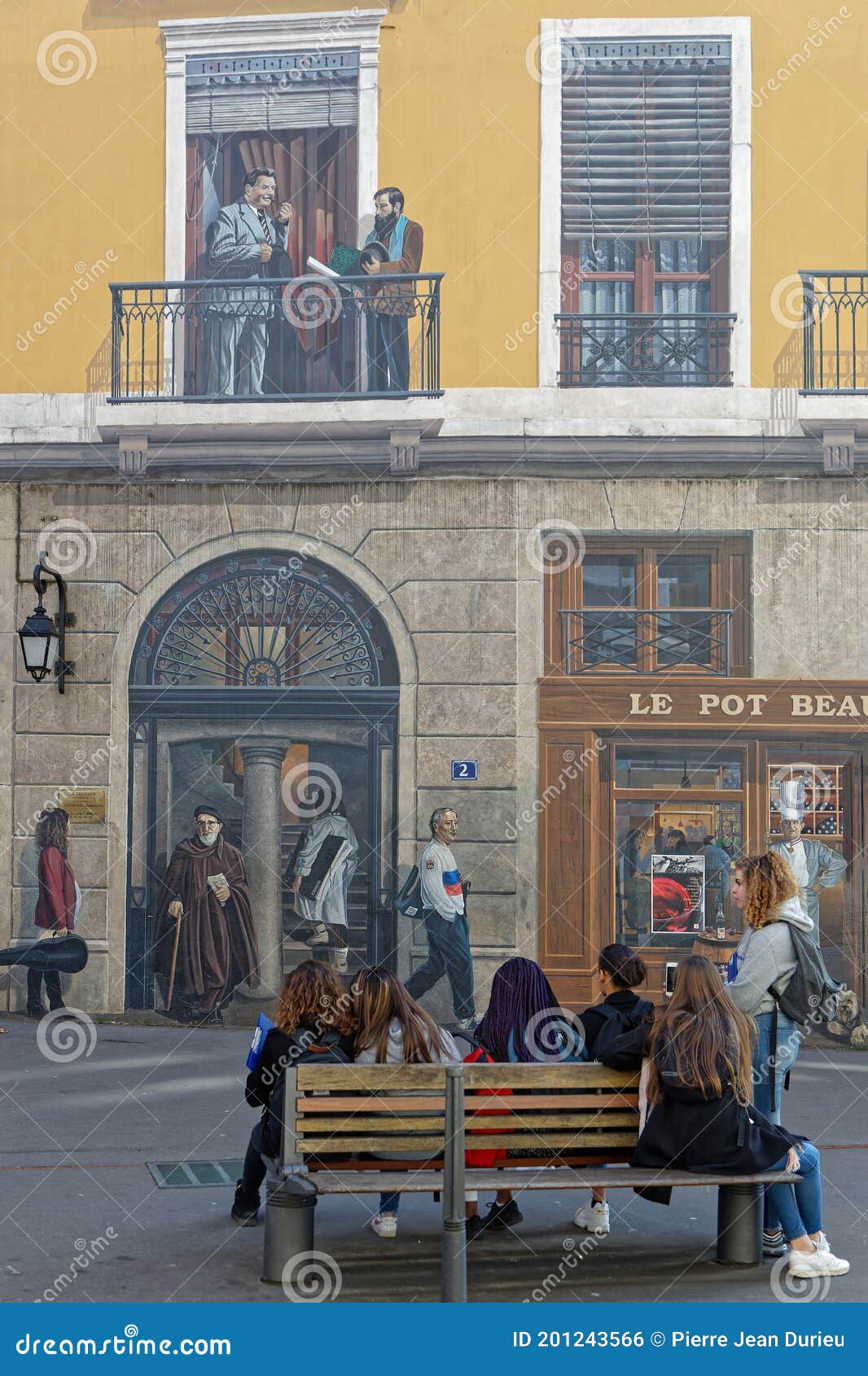 A Group Looks a the Famous People from Lyon Wall Painting Editorial