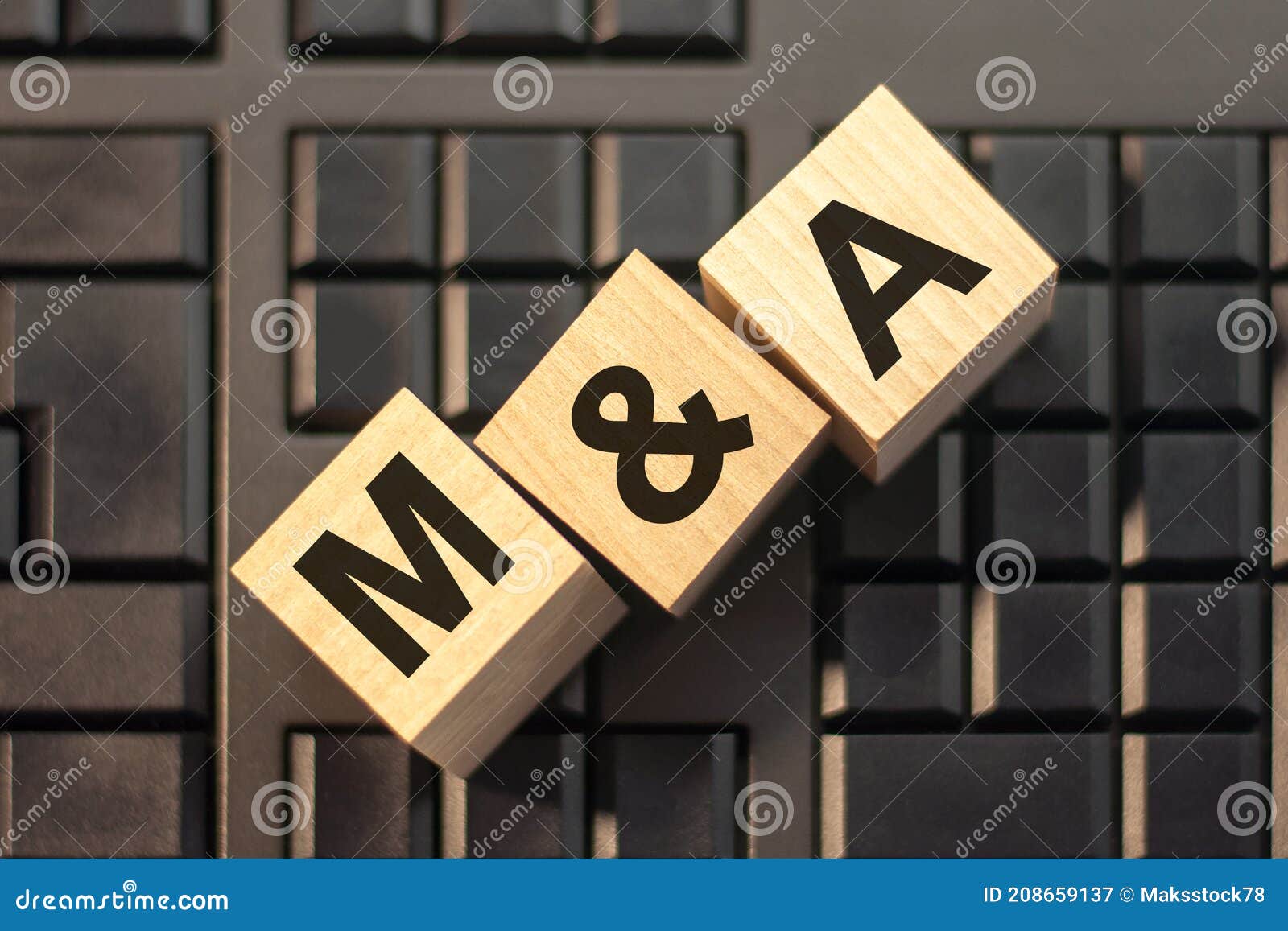m a - acronym from wooden blocks with letters, concept. m and a - mergers and acquisitions