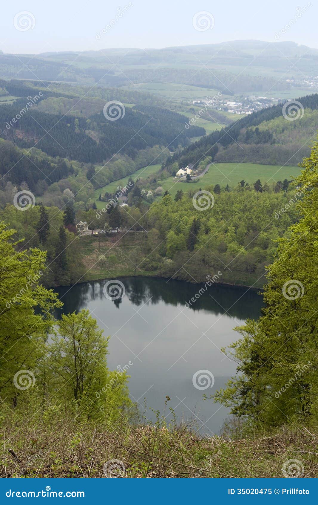 Idyllic scenery showing a maar in the Vulkan Eifel, wich is a region in the Eifel Mountains in Germany