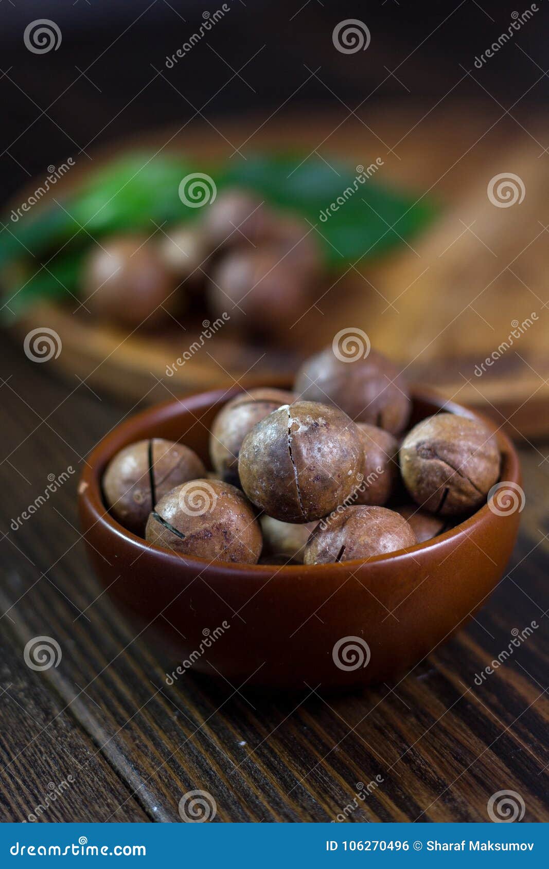 Macadamia Nuts in a Brown Ceramic Bowl. Stock Photo Image of wooden