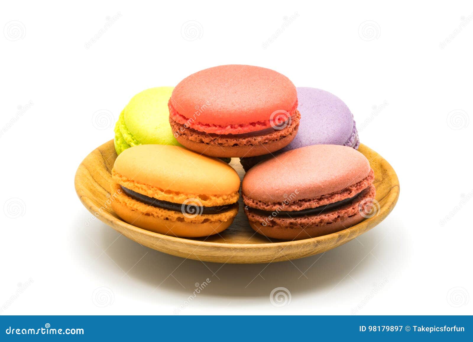 Macarons in wooden plate stock image. Image of candy - 98179897