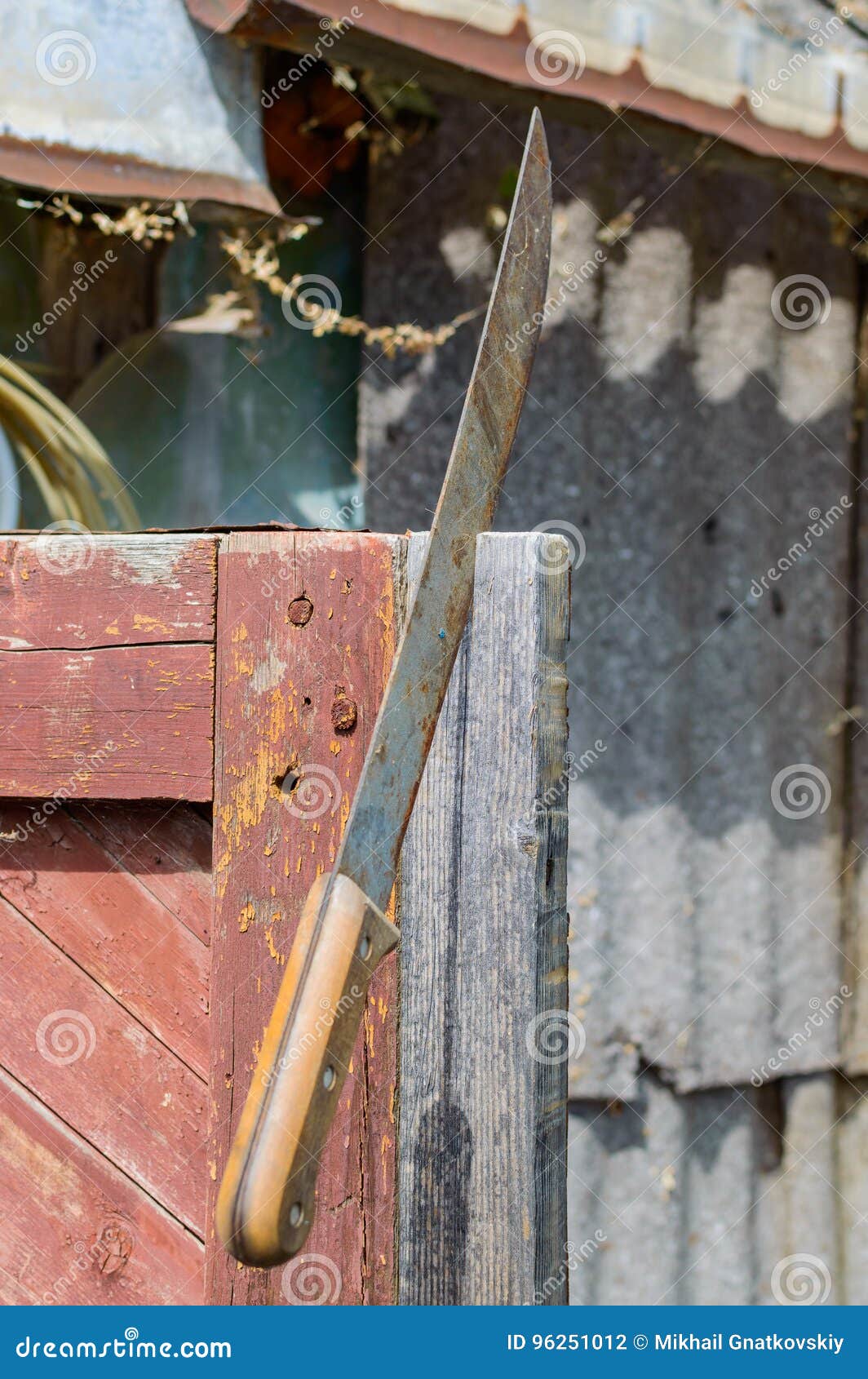Machete Stuck in the Wooden Construction for Safety. Stock Photo