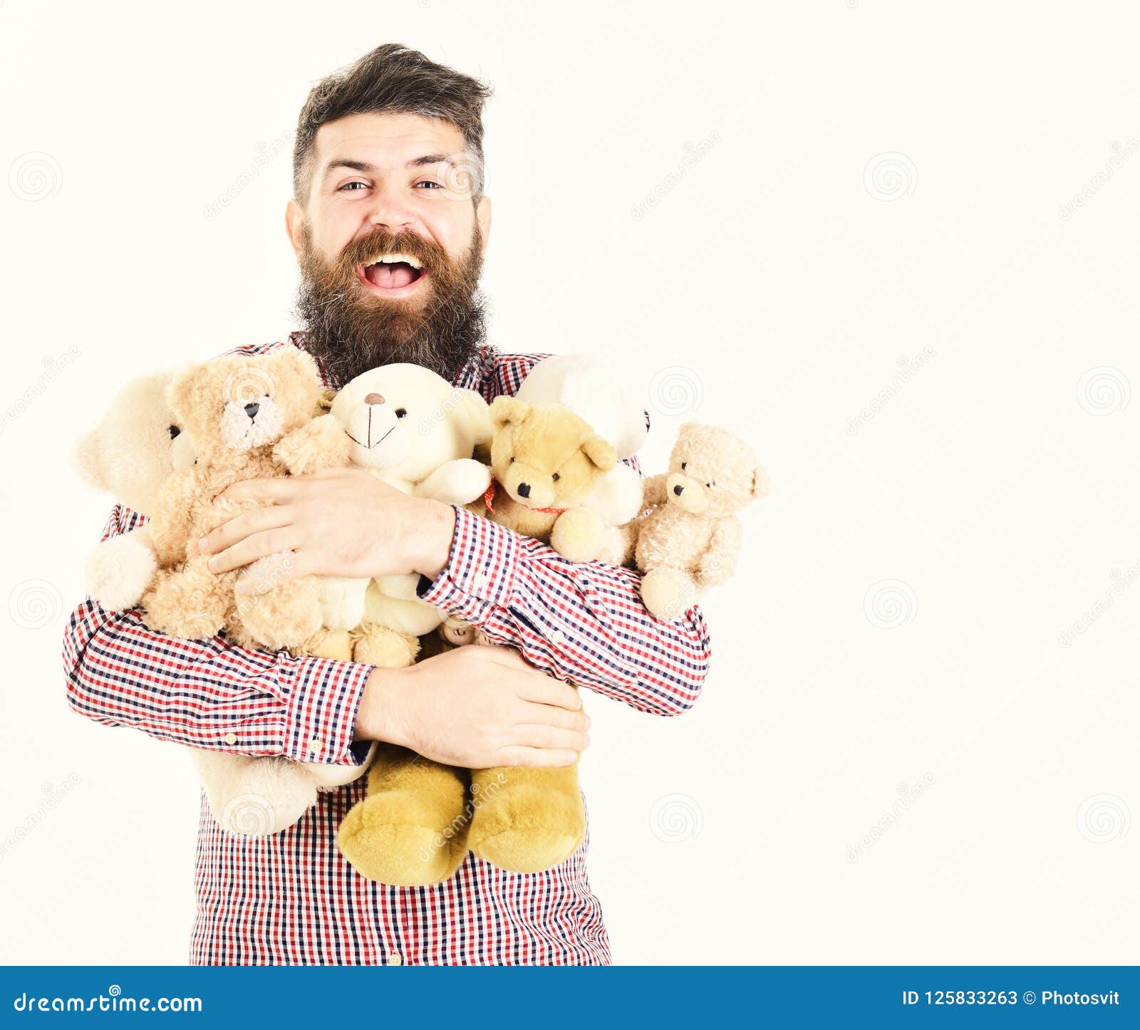 macho with beard hugs many teddy bears and plush toys. gifts and holidays concept. man with happyface holds pile