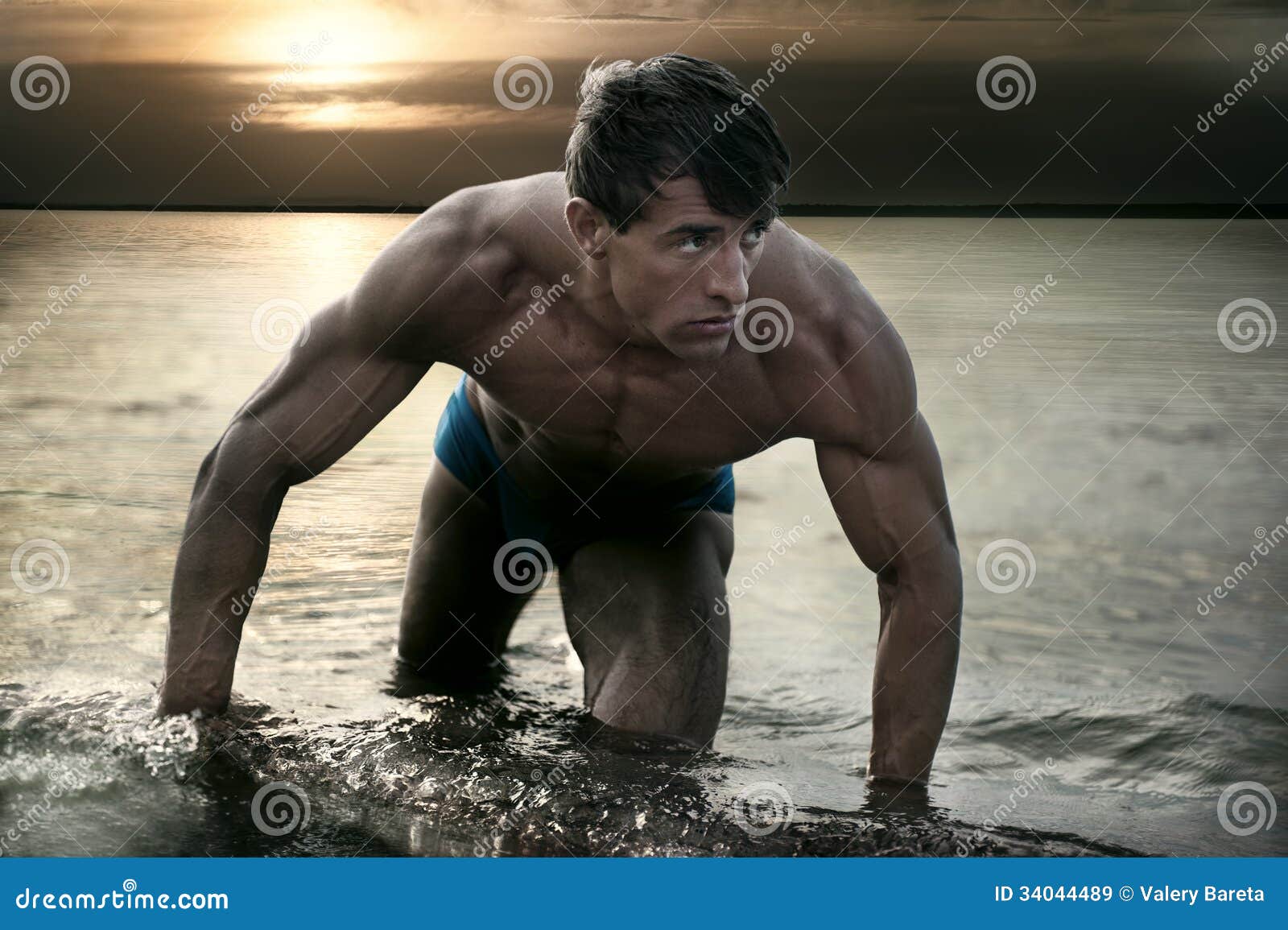 Muscular Wet Naked Young Man Posing In A Vest Stock Image 