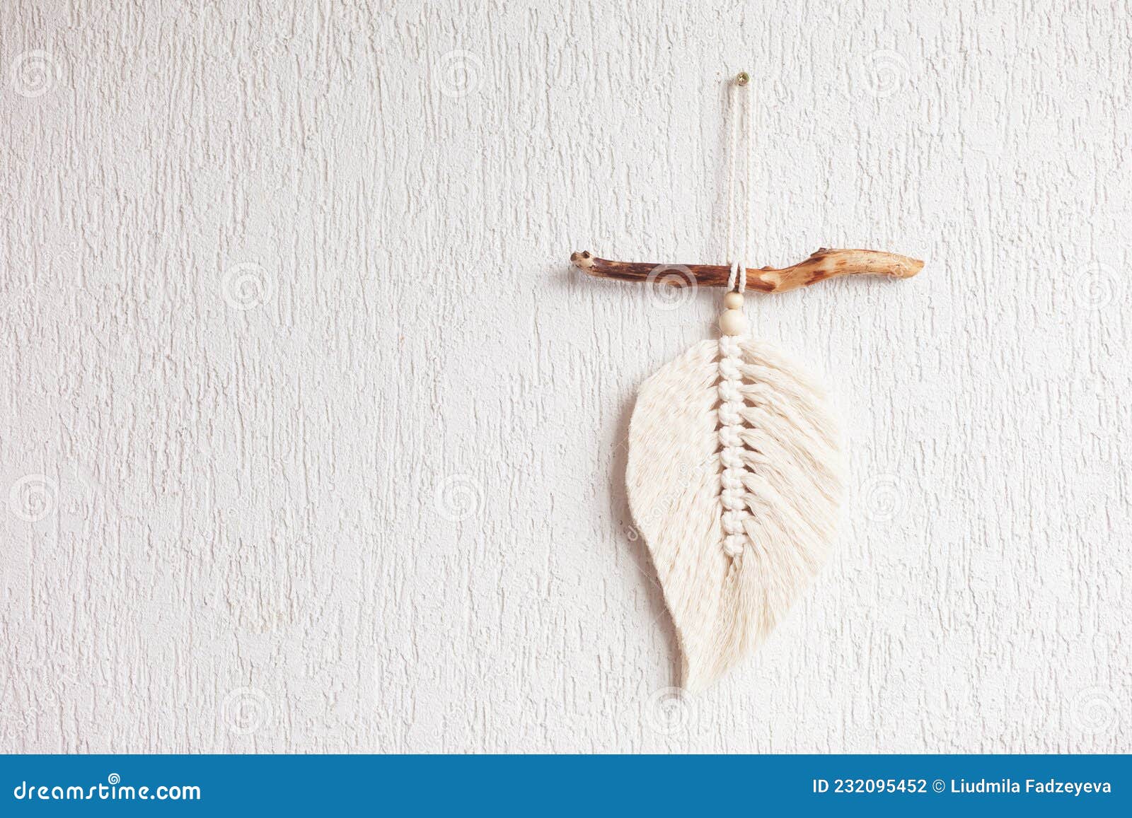 Macrame Leaf in Natural Color on a Wooden Table. Cotton Rope Decor