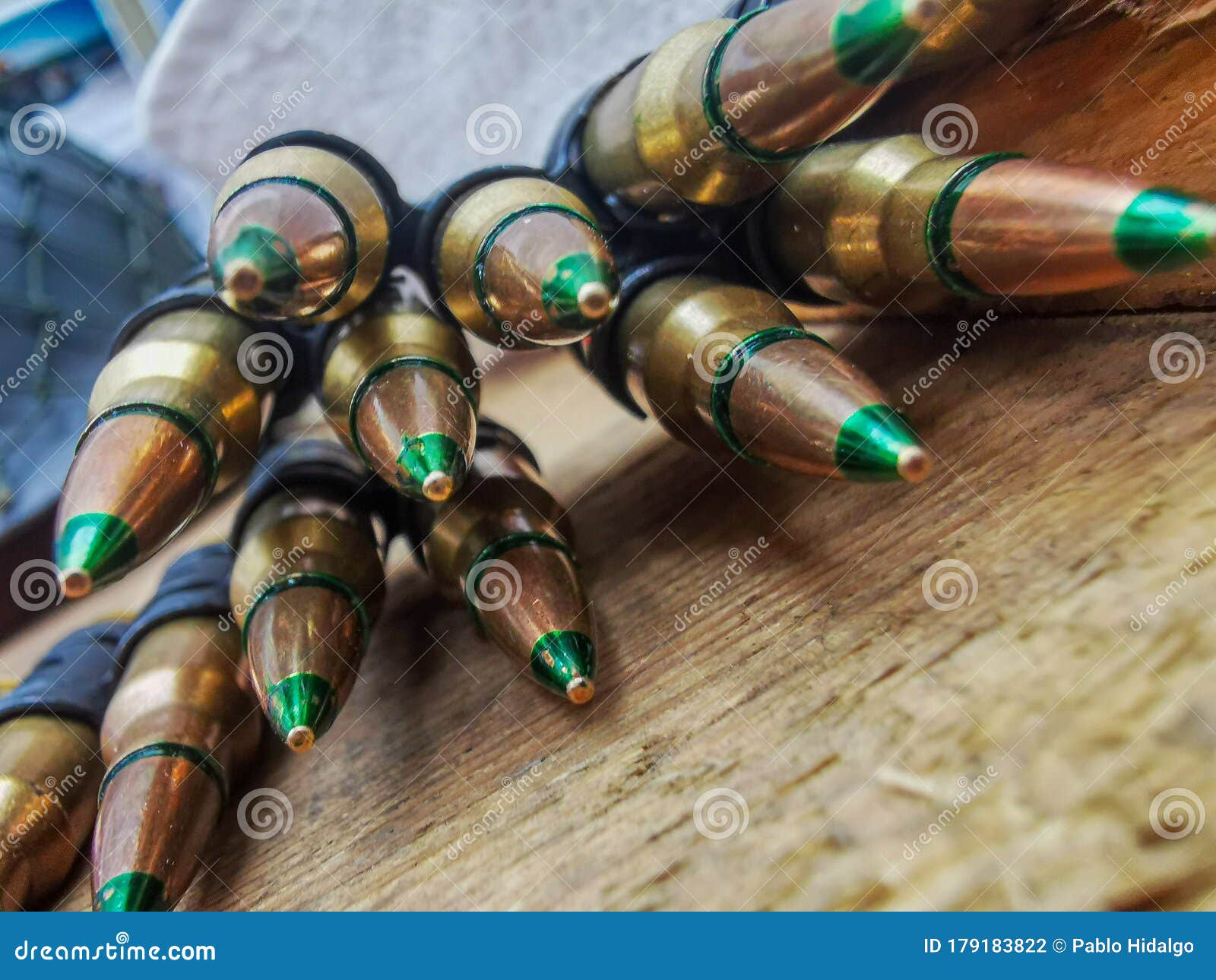 A Macro Close Up View of a Row of Regular Army Brass and Copper Bullets