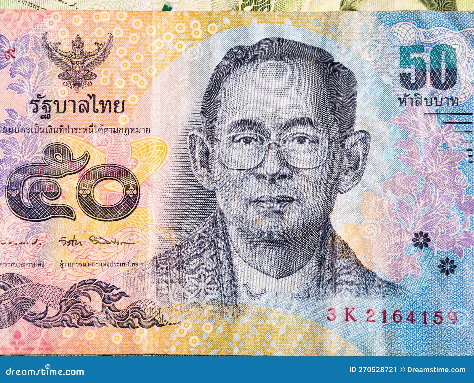 Macro Detail With A 50 Thai Baht Banknote The Baht Is The Official macro-detail-with-a-50-thai-baht-banknote-the-baht-is-the-official