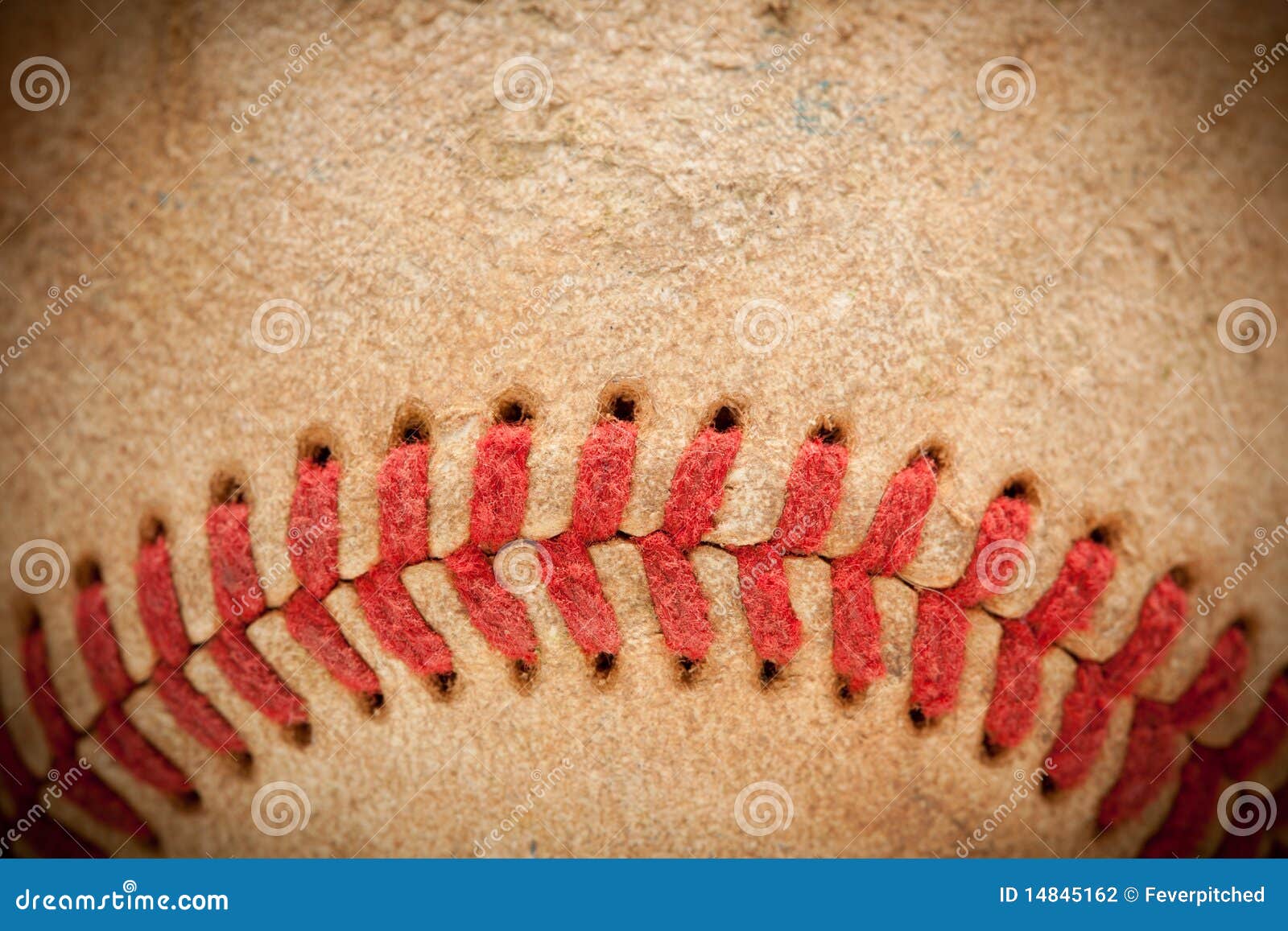 macro detail of worn baseball