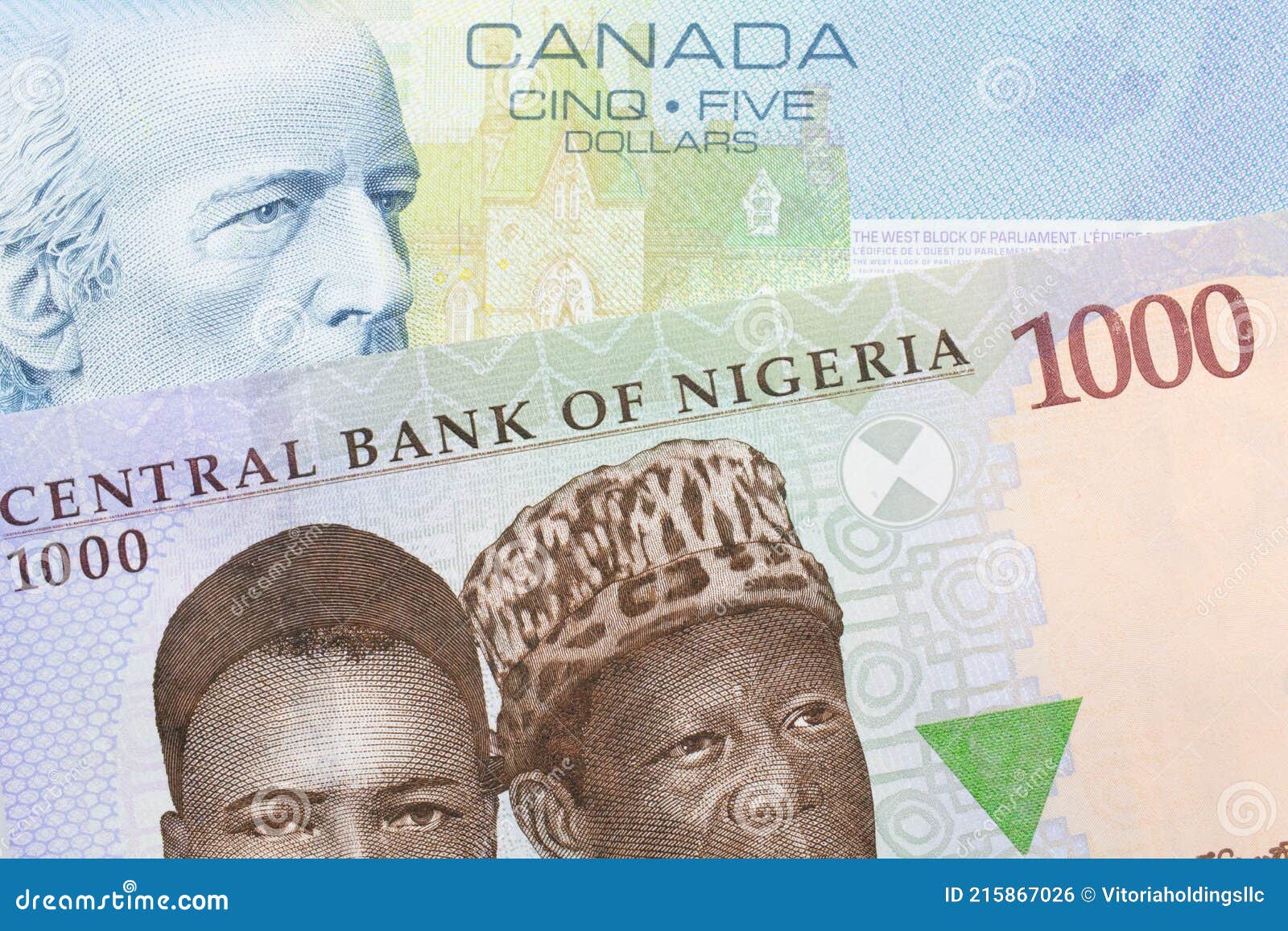 A Blue, Purple Green One Thousand Naira Note from Nigeria Paired with a Blue Five Dollar Bill from Canada. Stock Photo - Image of currency, banking: 215867026