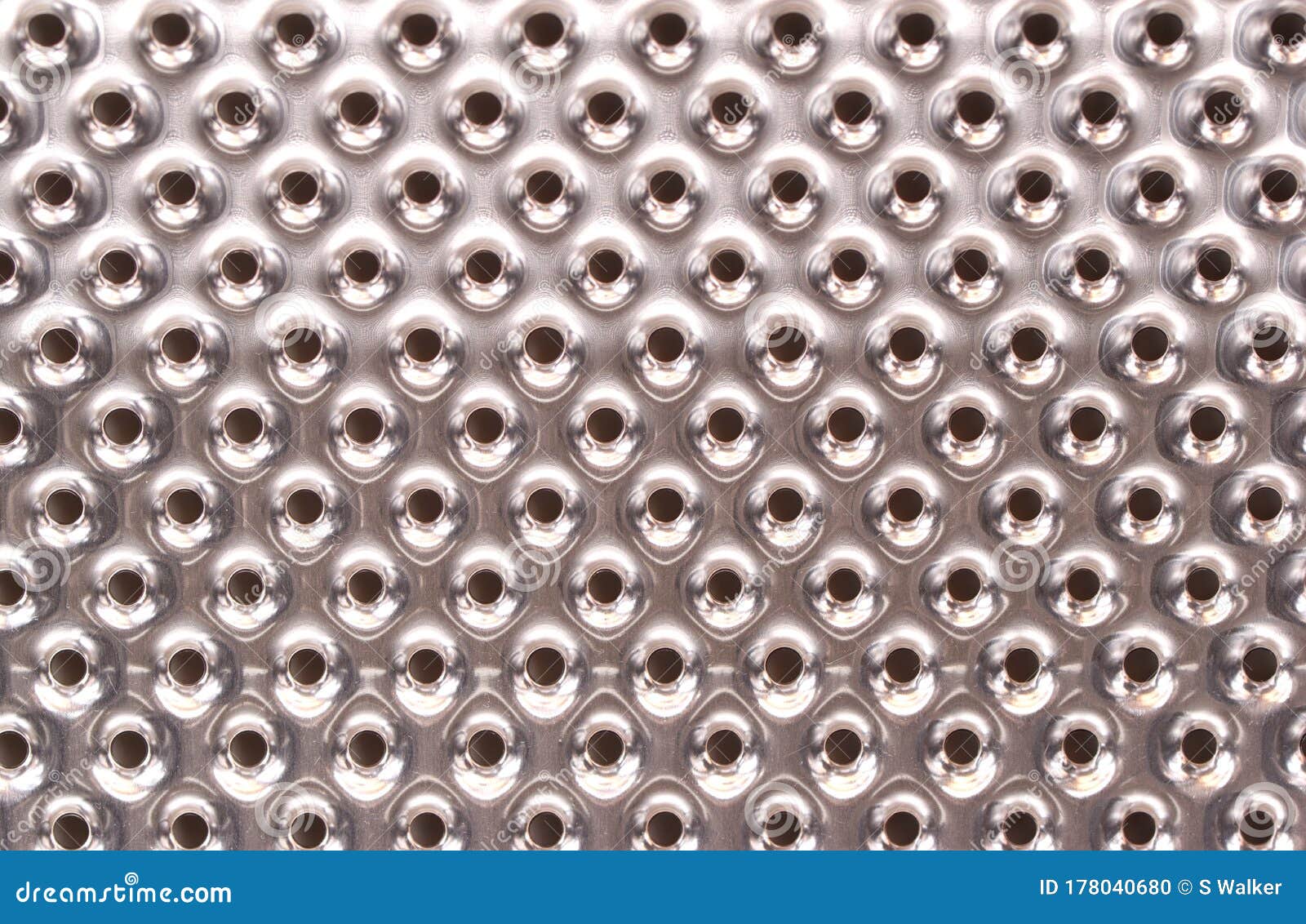 interior, stainless steel washing machine drum, macro.