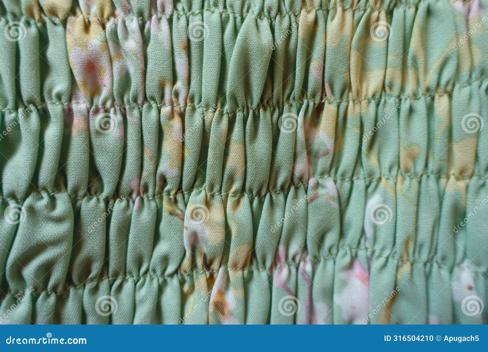 macro of mint green rayon fabric with shirring