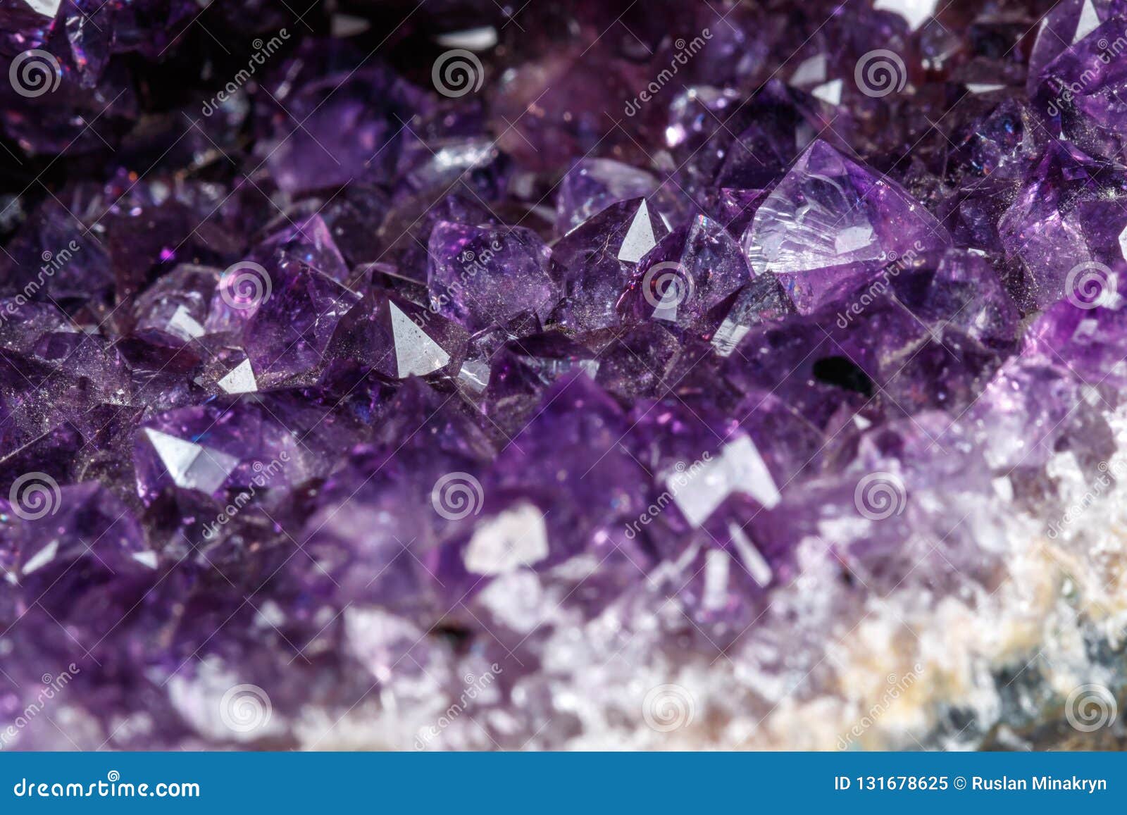 Macro Mineral Stone Amethysts in the Rock on a White Background Close ...