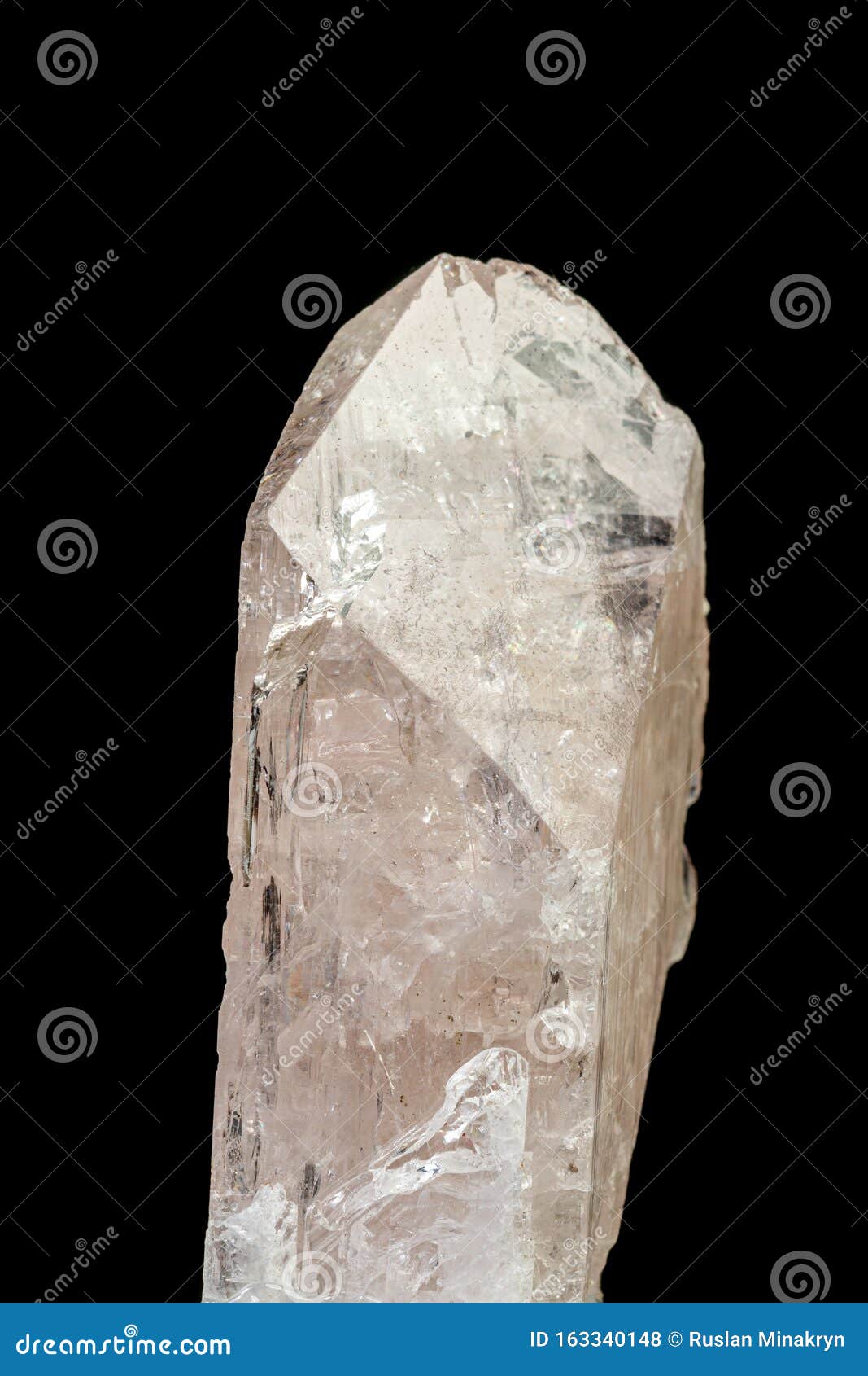 macro mineral stone danburite on a black background