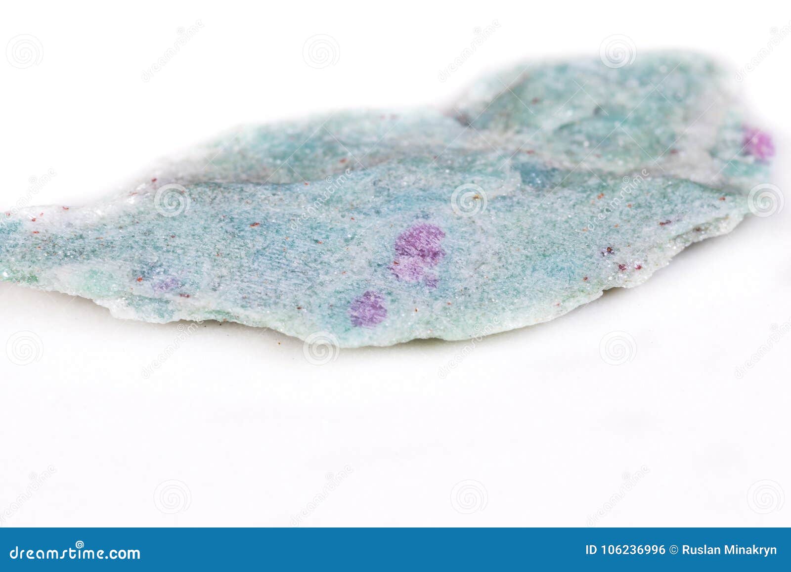 macro mineral stone ruby in zoisite on white background